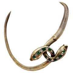 Bracciale a serpente con diamanti e smeraldi in oro giallo 14K