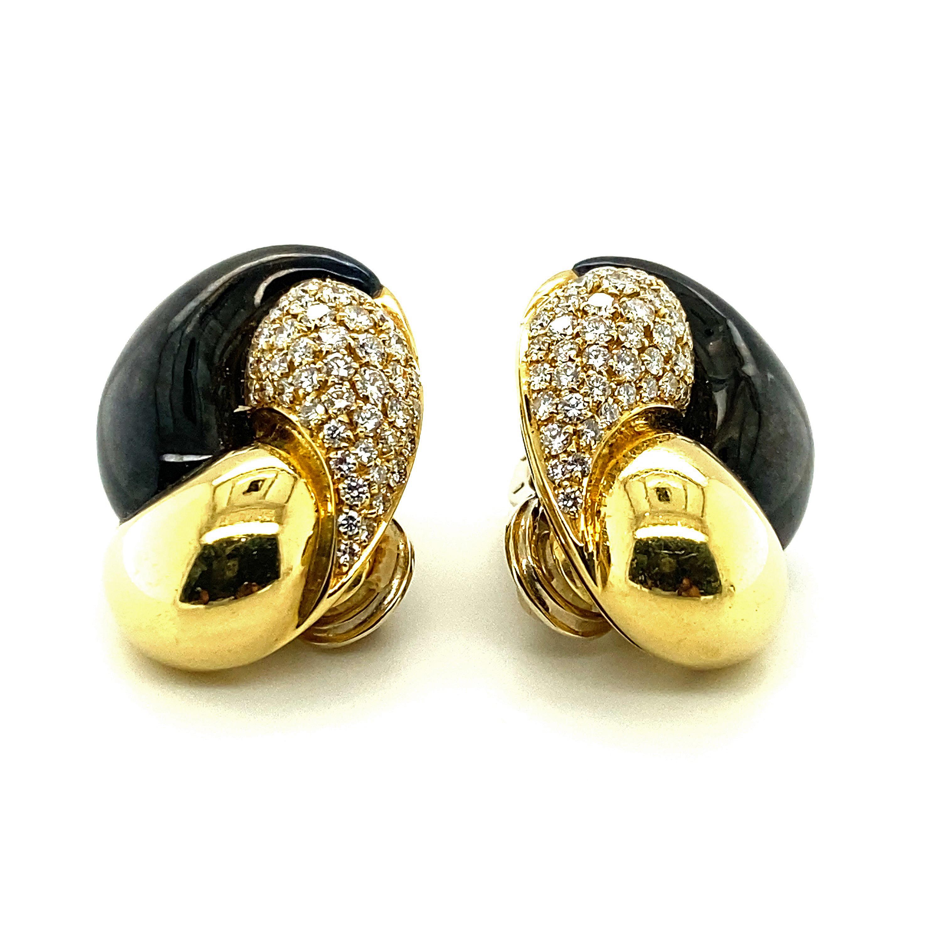 A pair of 3-section swirl-motif earrings composed of polished 18k gold, highly reflective hematite, and approximately 2 1/2cts of pave-set diamonds combined together in a profile of curved contours and distinct yet complementary colors.  

Stamped
