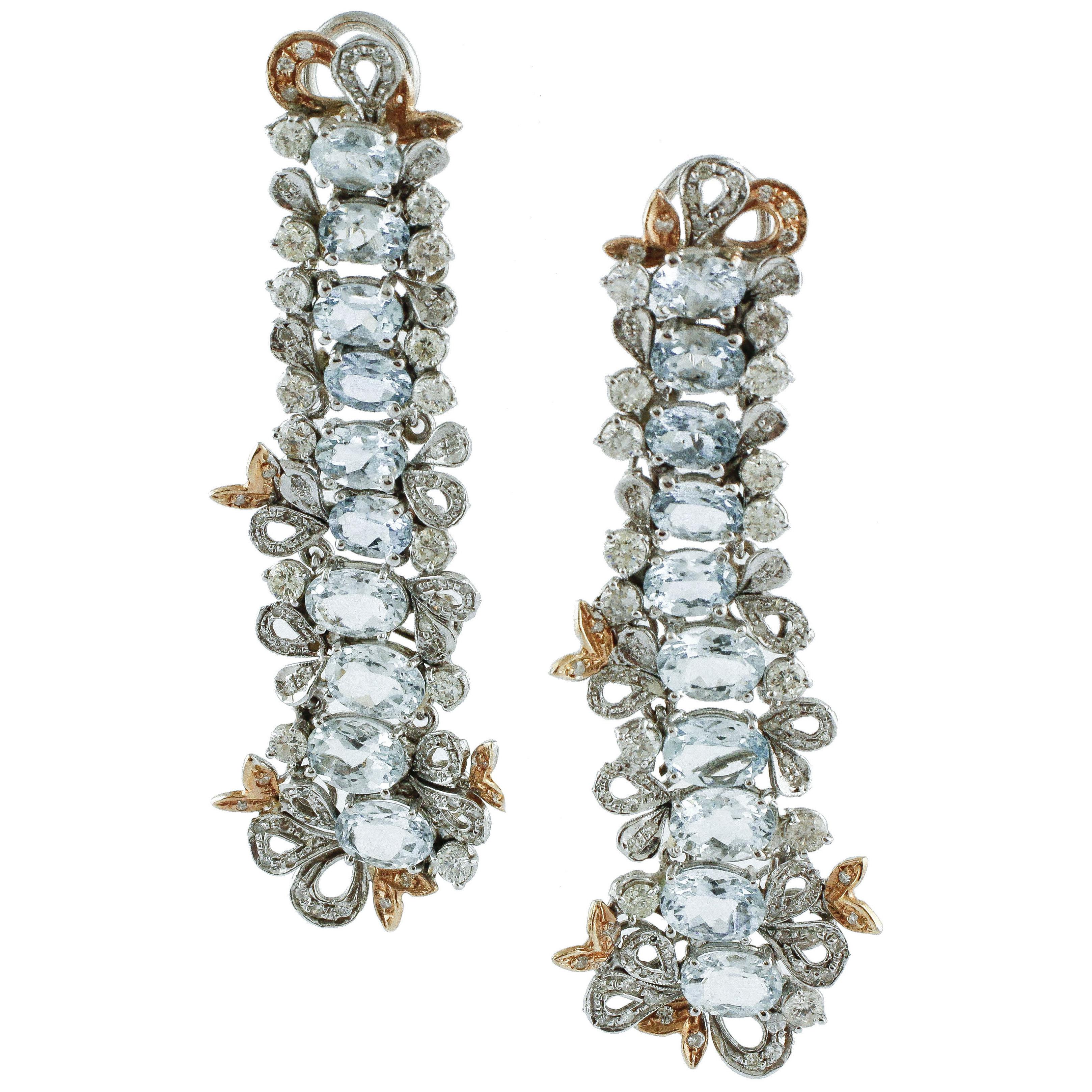 Boucles d'oreilles pendantes en or avec diamants et aigue-marine