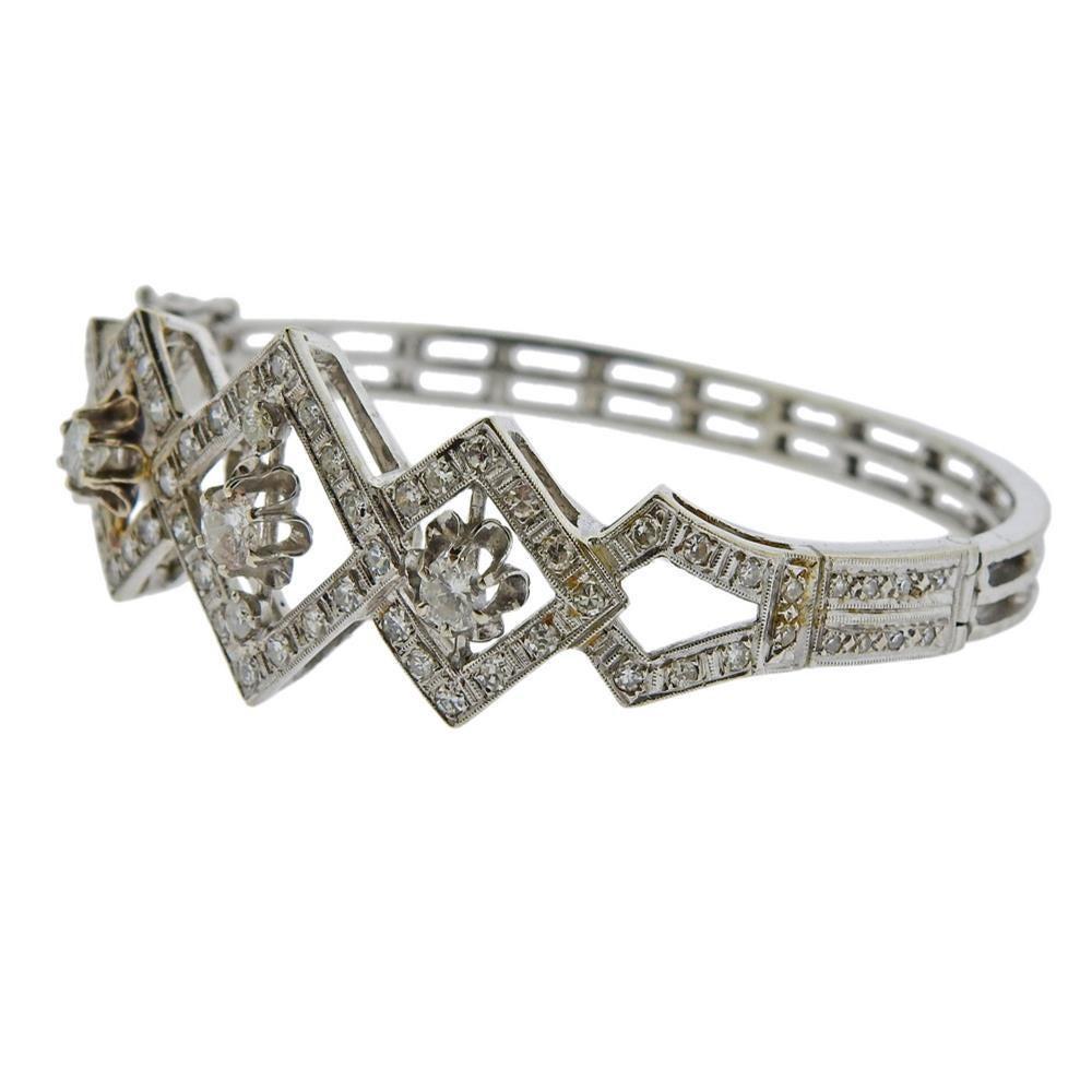 14k white gold bracelet. Set with diamonds approx. 2.00ctw.  Measures - 60mm inner diameter, will fit approx. 7.25