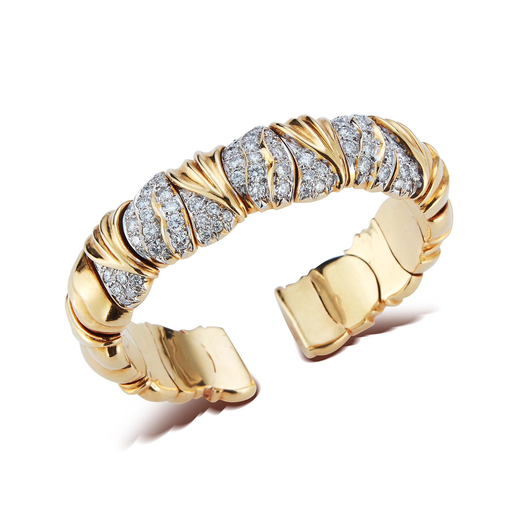 Gold & Diamond Bangle Bracelet 

Made by Elan, Circa 1980s

72 Round Cut Diamonds

Inner diameter: 2.25