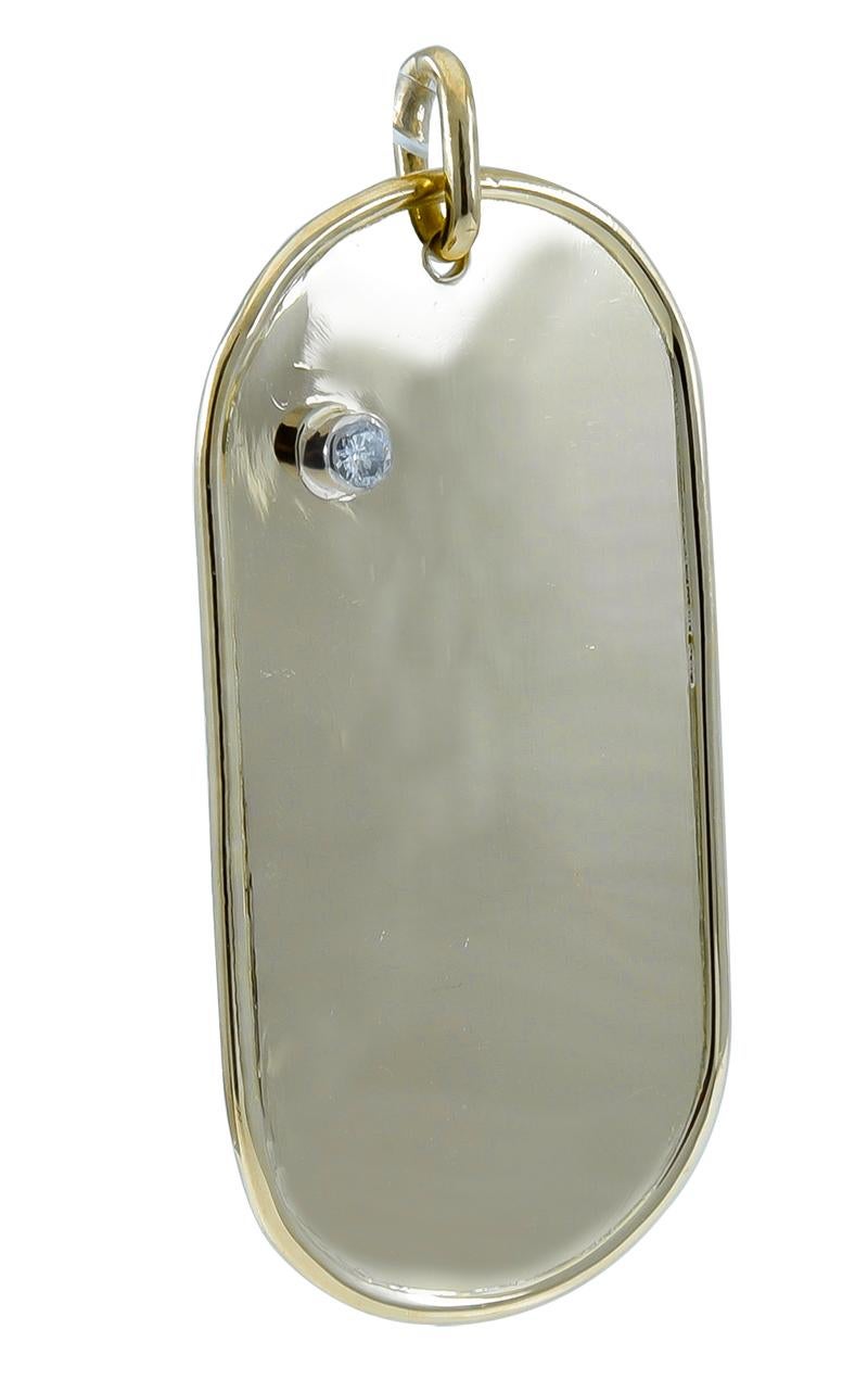 Dog tag, set with a faceted diamond.  Made, signed and numbered by CARTIER.  Beveled edge.  18K yellow gold.  2