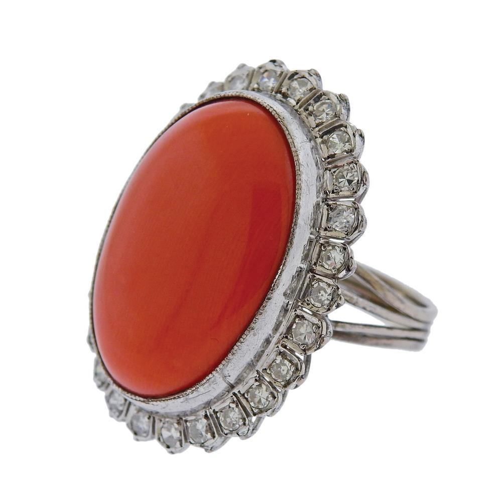 Large 10k gold ring with natural coral - 27mm x 19mm and diamonds approx.0.78ctw.  Ring size 4 1/4, ring top is 34mm x 25mm. Weight 13.5 grams. Tested 10k gold.