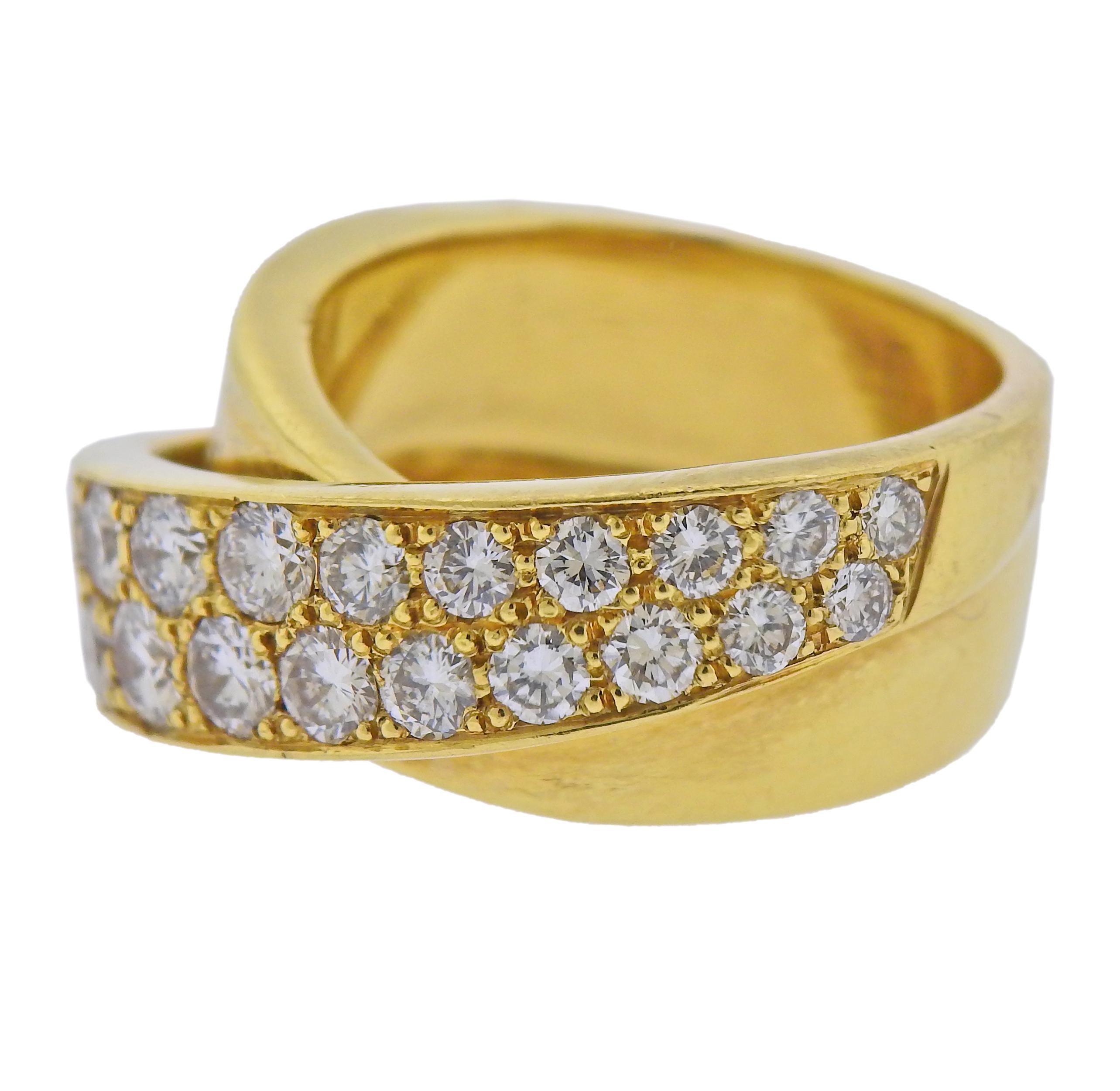18k yellow gold crossover ring with approx. 3.00ctw in diamonds. Ring size - 9, ring top is 13mm wide. Minor dents are present. Marked: 18k. Weight - 26.6 grams.