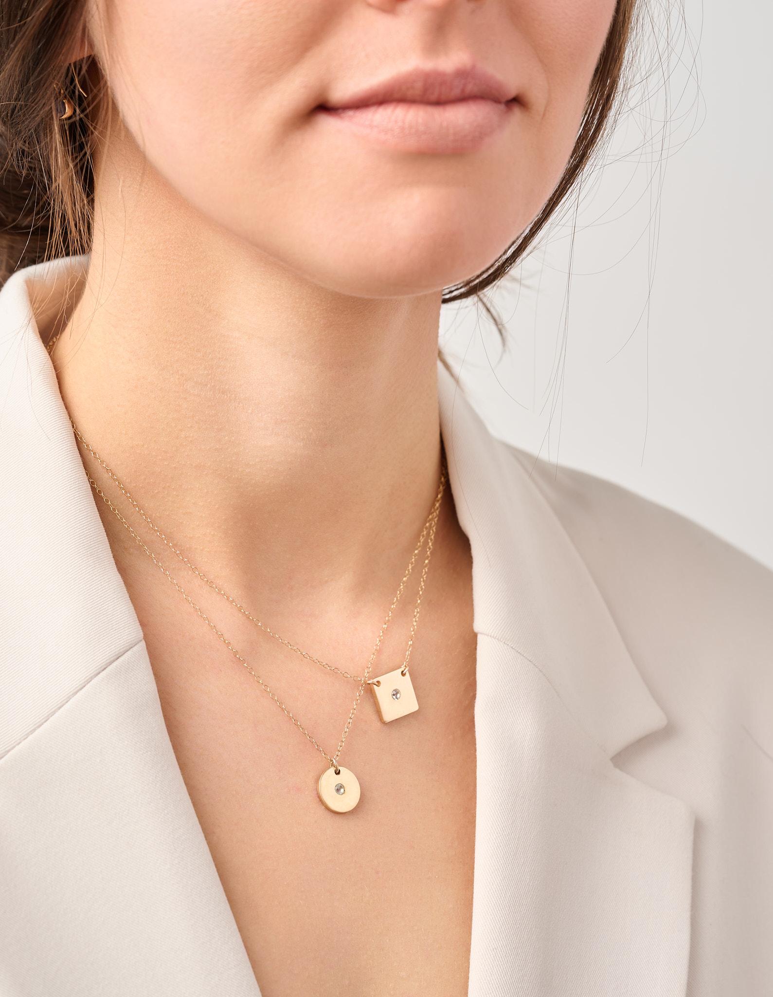 A beautiful, simple floating disk necklace with diamond accent. Perfect for everyday wear. Heirloom quality.

-14k solid gold
-3mm diamond (.48 ct)
-gypsy setting
-12mm 18k disk (1/2