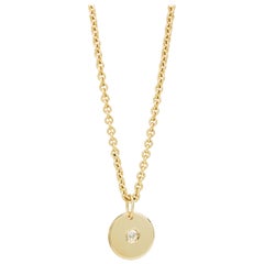 Collana con disco di diamanti in oro