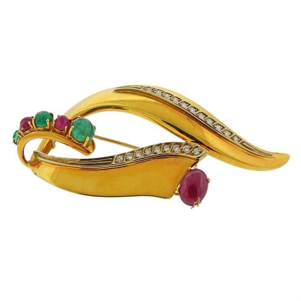 18k yellow gold brooch, with emerald and ruby cabochon and approx. 0.40ctw in diamonds. Tested 18k. Measures 77mm x 35mm. Weight 19.5 grams.
