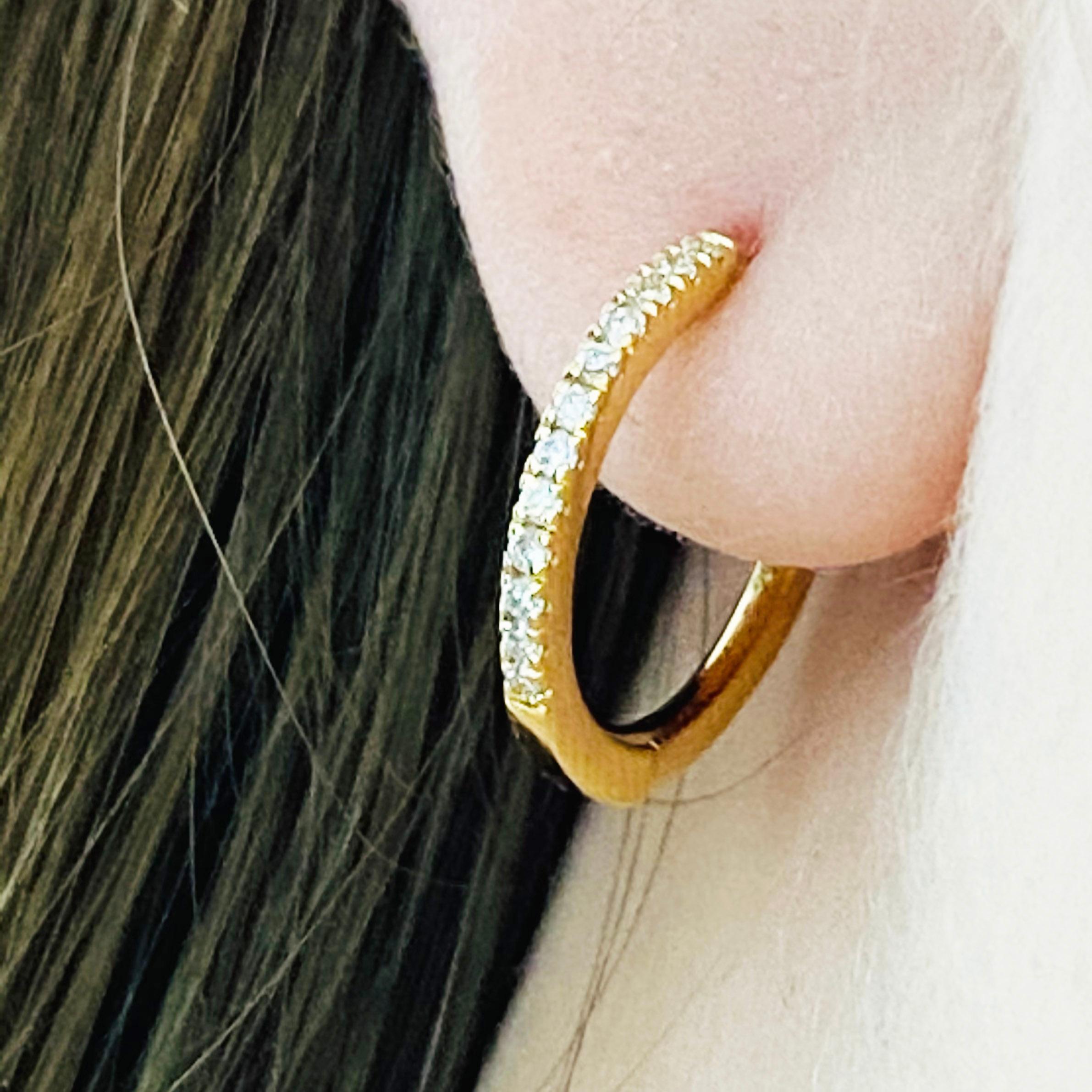 Our 2020 best selling earring! These stunning polished 18k yellow gold diamond hoops provide a look that is both trendy and classic. While they were once worn by kings and queens to signify power and social status, hoop earrings are now considered a