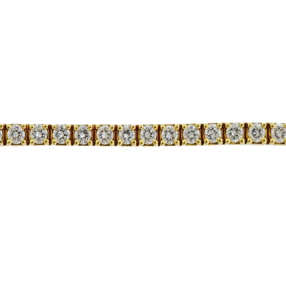 18k yellow gold line bracelet, set with approx. 3.60-4.00ctw in diamonds (52 stones). Marked 18k. Measures 7 1/8