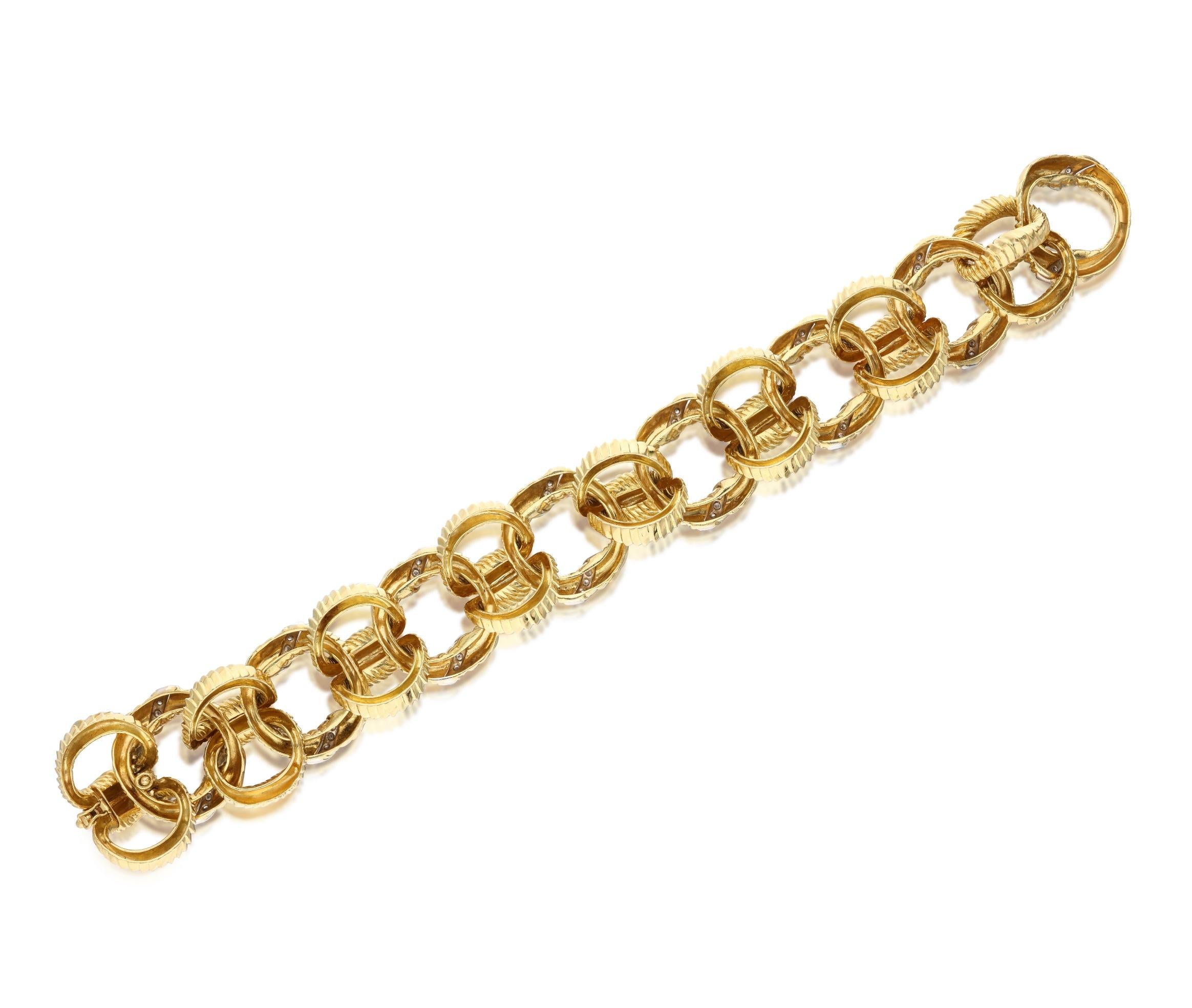 An 18 karat yellow gold textured link bracelet accented by diamonds. The round cut diamonds weigh a total of approximately 1 carat, and are approximately G-H color and VS clarity. Total weight: 105.20 grams. Length: 9 inches.
