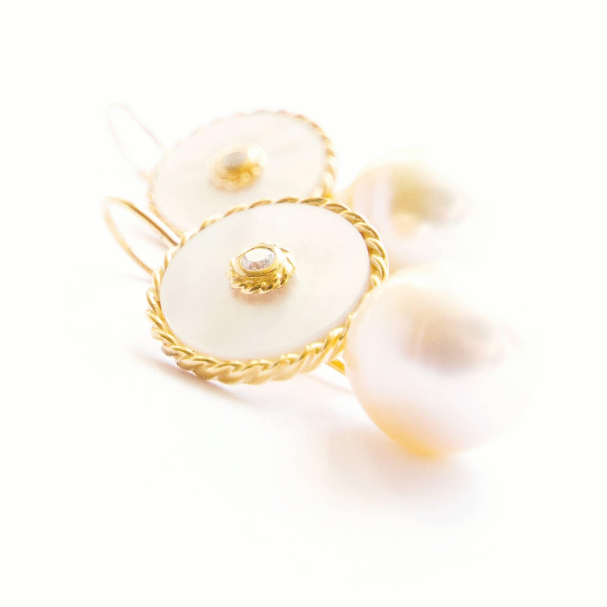 Interchangeable Earrings. 18K gold vermeil earrings with 18K gold hook. 0,07 crt diamonds (total 0,14 crt) and South Sea pearls. These white mother-of-pearl beauties provide a stylish, understated accent to almost every outfit or occasion.  A