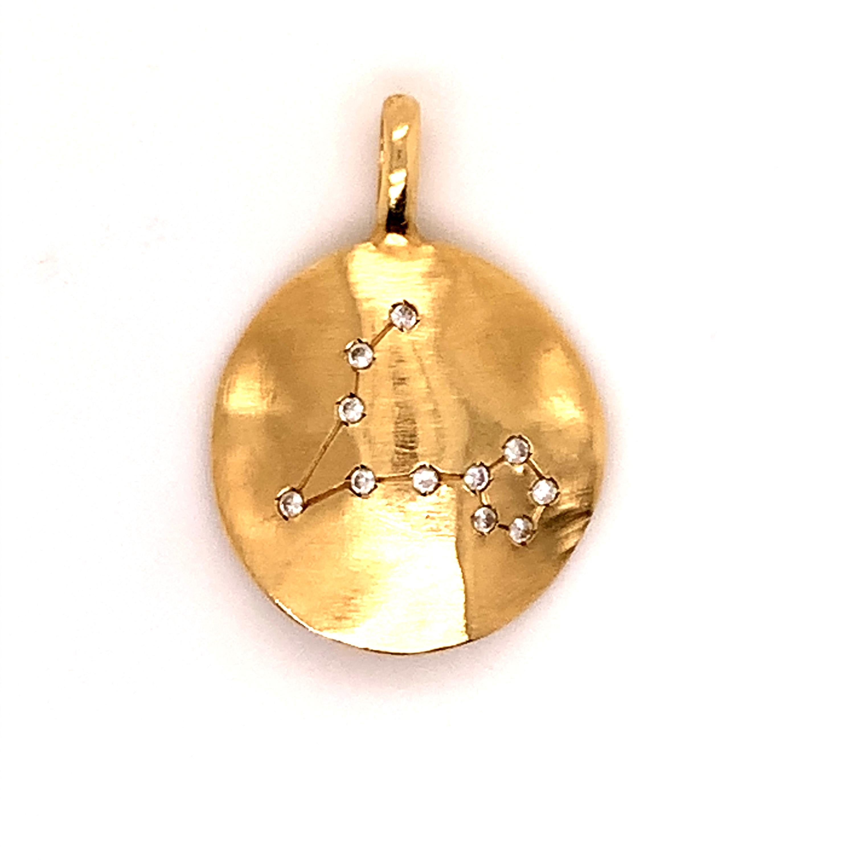 Lovely charm:  unusual convex shape with diamonds depicting the PISCES constellation.  14K satin finish yellow gold on front; shiny gold on back.  2/3