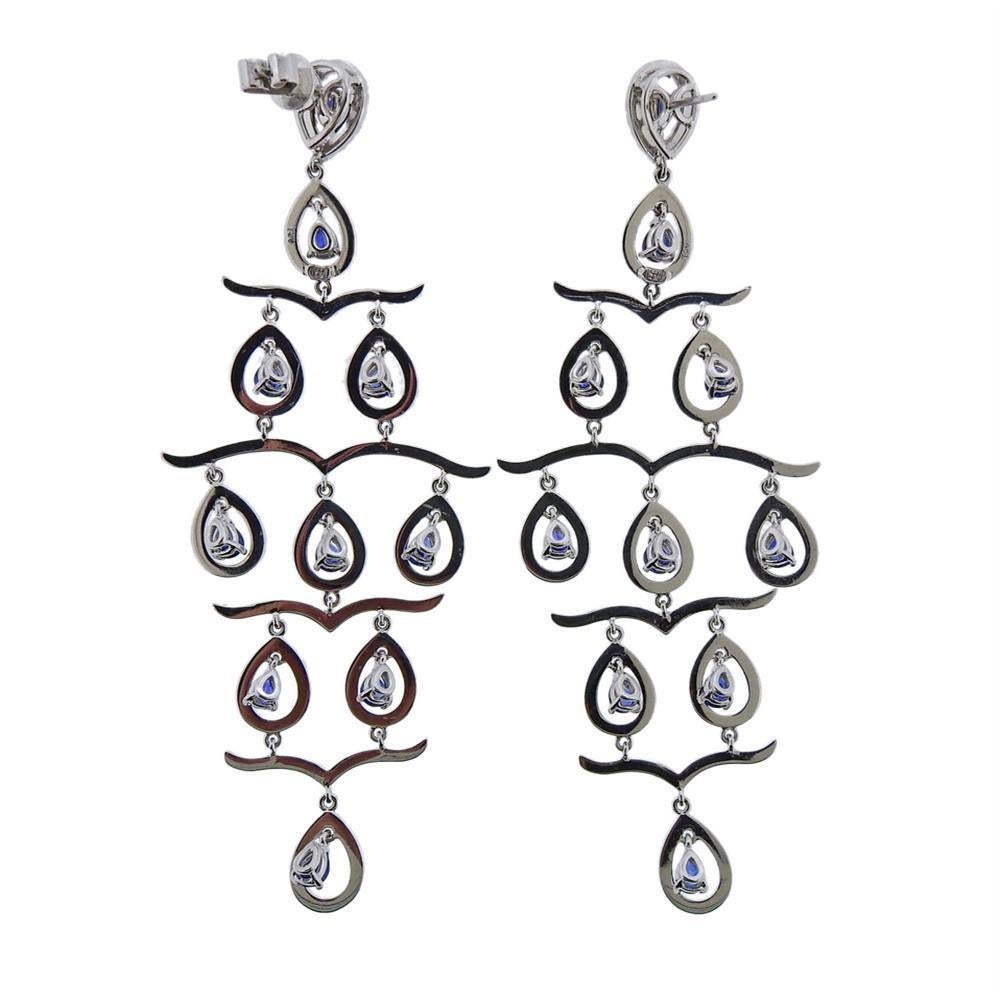 18k gold long chandelier earrings with sapphires and approx.3.50-4.00ctw in diamonds . Measures 90mm x 34mm. Weights 19.7 grams. Marked 750. One back is missing and one is 14k gold (marked 585). One earring back is missing and one is 14k gold.