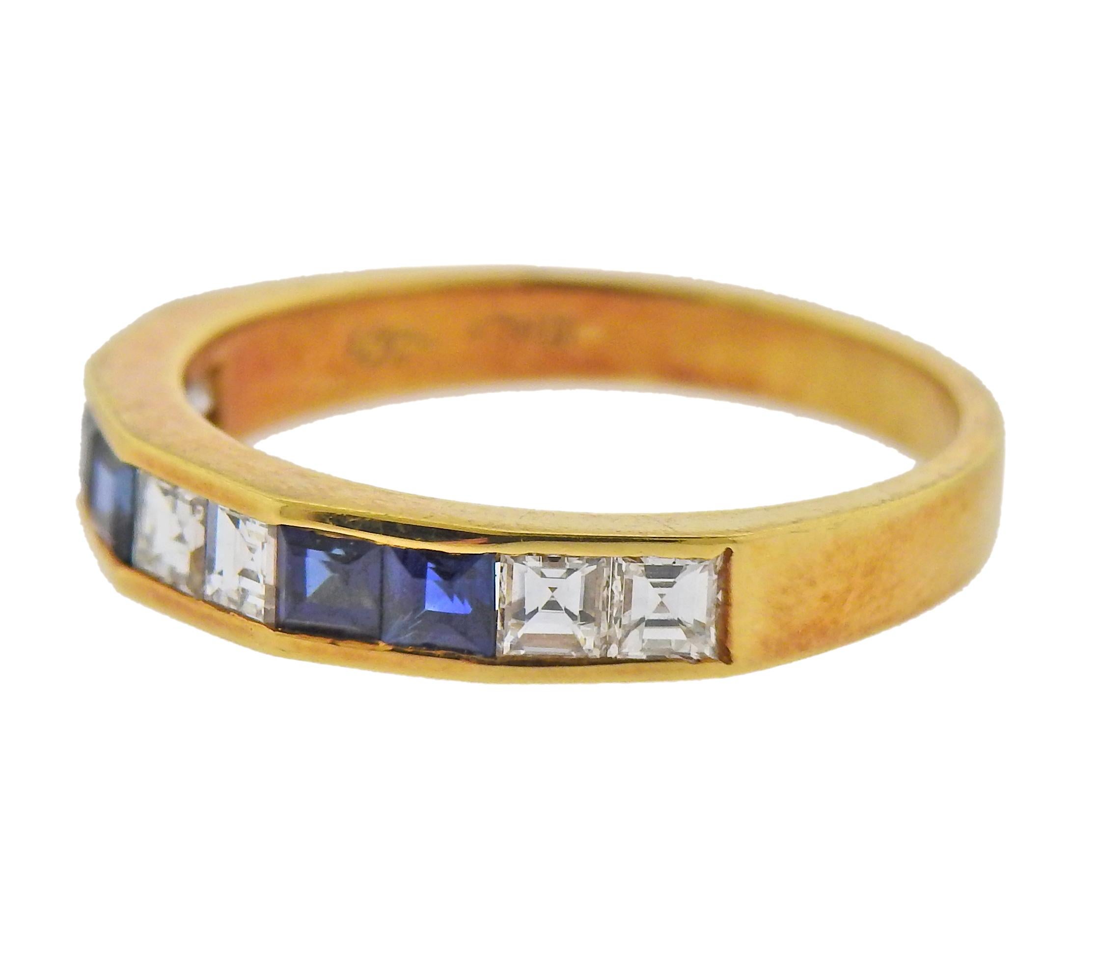 18k gold ring with alternating sapphires and diamonds (approx. 0.48ctw). Ring size - 6.75, ring is 3.8mm wide. Marked: Italy, 750. Weight - 3.4 grams.