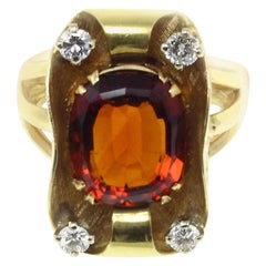 Anello d
oro con diamante e topazio