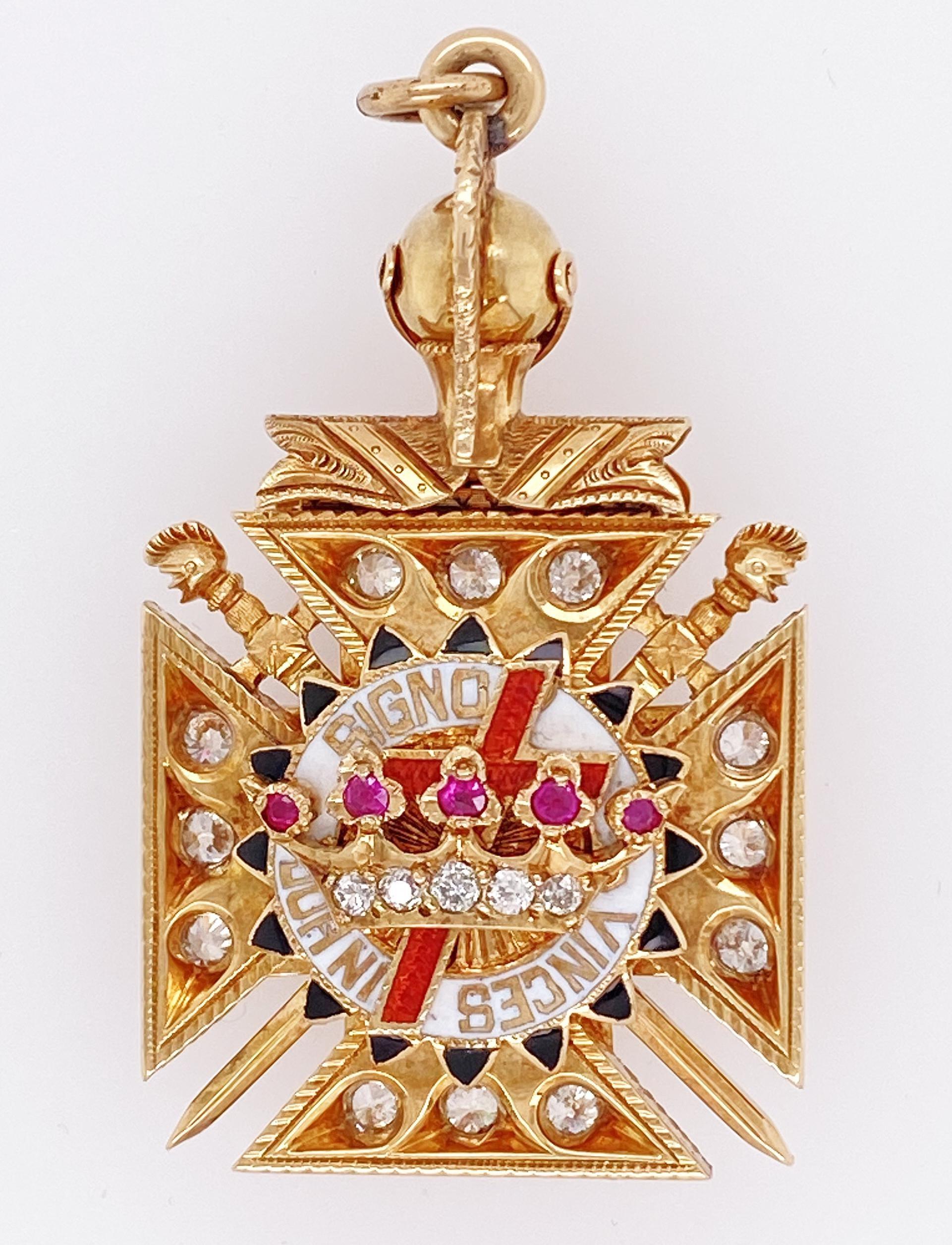 18K Y/gold enamel ruby diamond pendant. One side with two headed eagle the other side a diamond crown, movable warrior's visor. Old European cut diamonds weighing approx. 1.35 cts, IJ VSstamps Modele FC 750 Depose MADE IN ITALY, measures 1 3/4 x 1