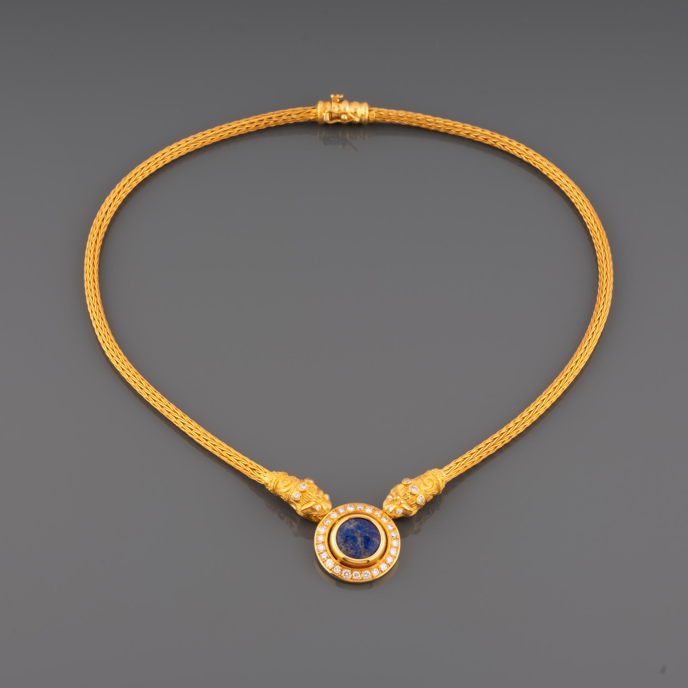 A very lovely necklace, greek made.

Made in yellow gold 18k, set with 1.50 carats of diamonds and a Cabochon of lapis Lazuli.

The length is 42cm, the diameter of central part is 22mm.

Weight: 39 grams