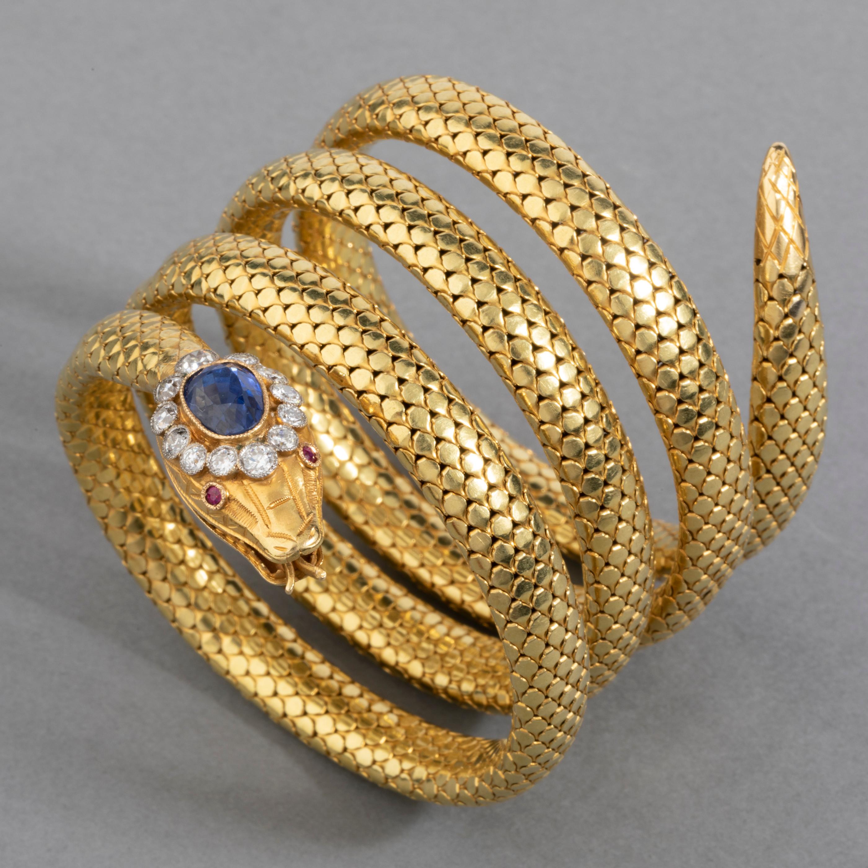 Gold Diamonds and Royal Blue Sapphire Antique Snake Bracelet

Very beautiful snake bracelet. Made in France circa 1880. 
Made in yellow gold 18k.
Two eagle head marks (gold 18k), mark of maker (Unknown), mark of Patent (certifié SGDG).
The Head of