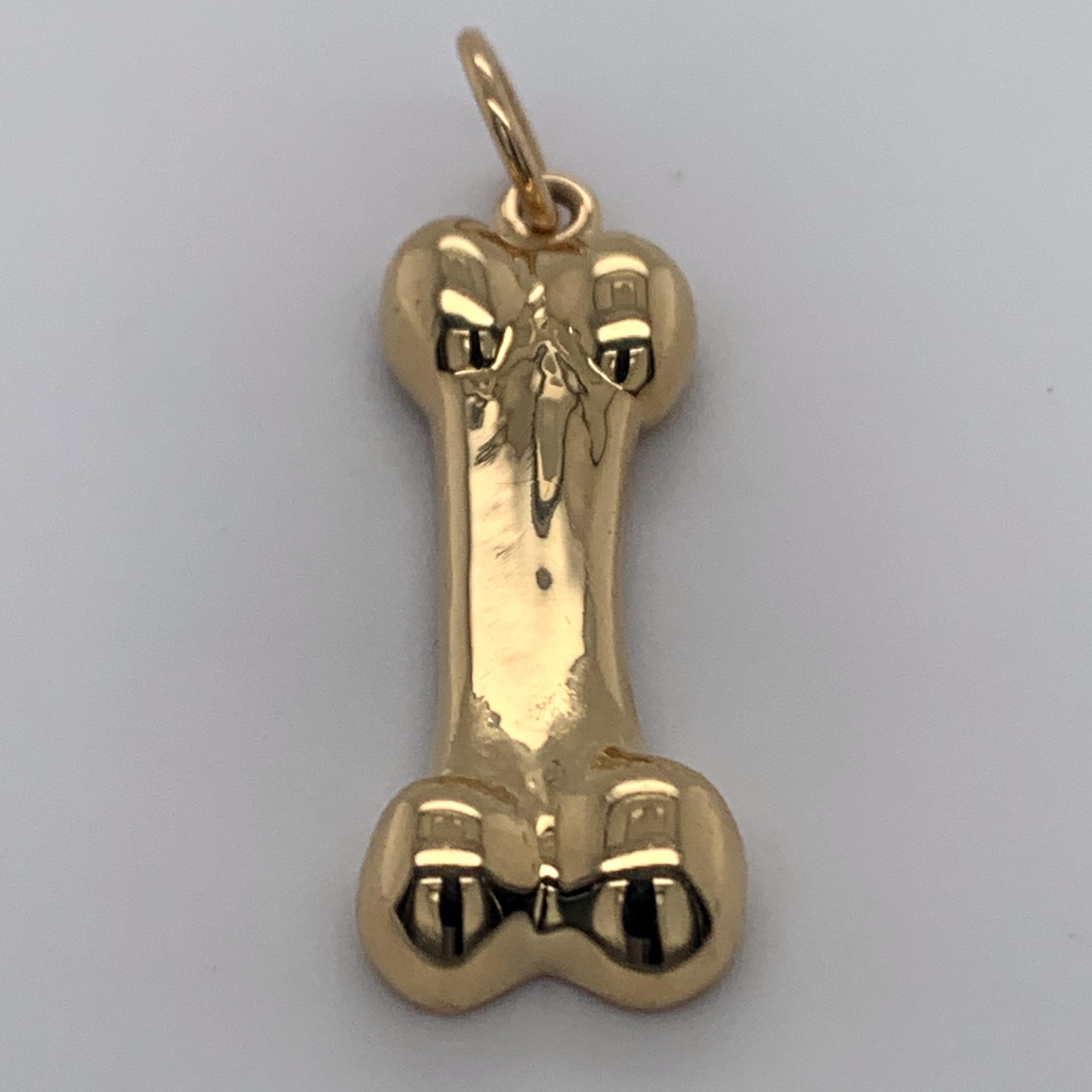 Gold Dog Bone Charm In Excellent Condition In New York, NY