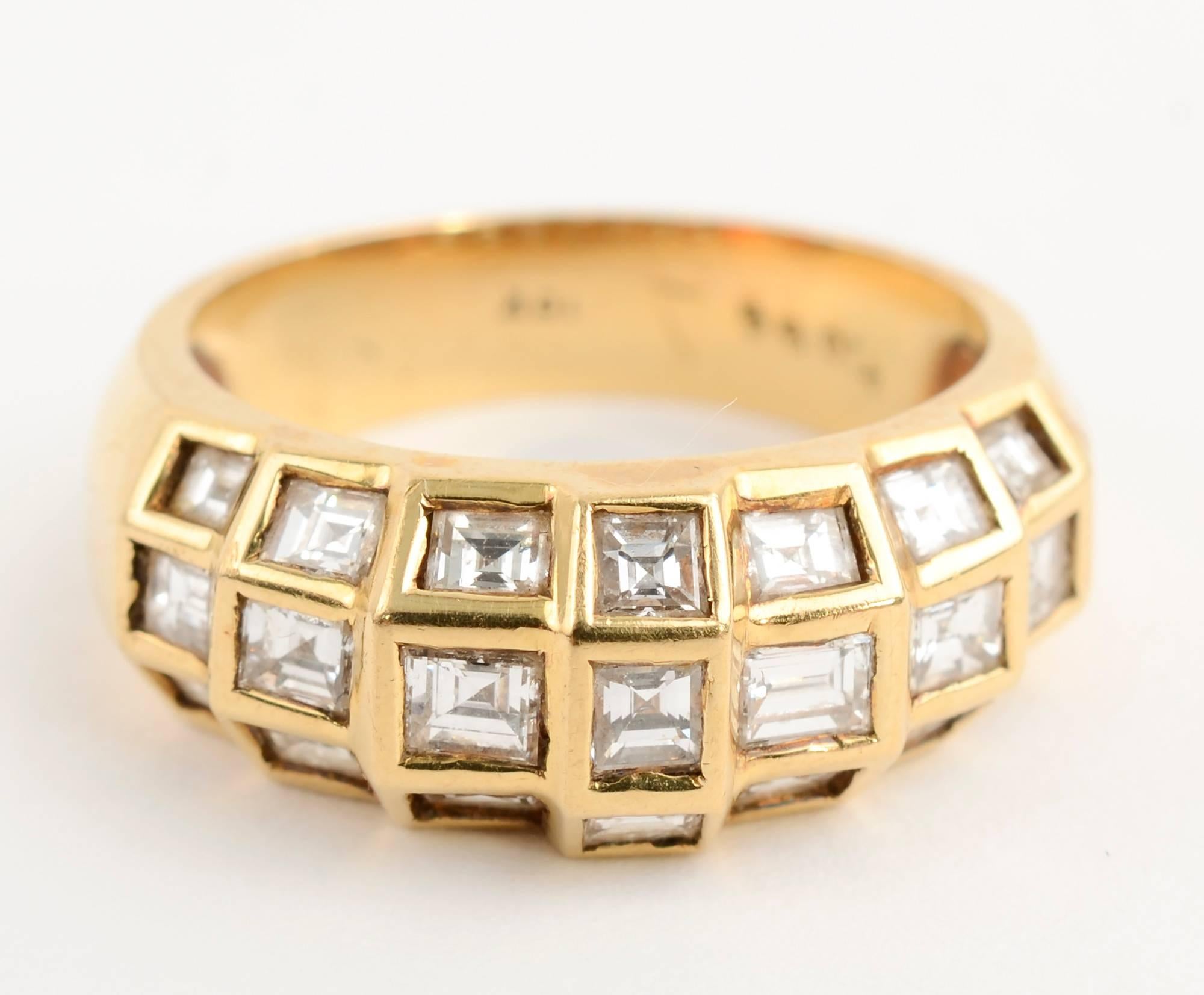 Domed ring set with 21 square and rectangular diamonds weighing approximately 1 carat. The diamonds are set in square stepped jackets giving a nice dimensionality to the ring. It is size 6 and can easily be adapted larger or smaller.