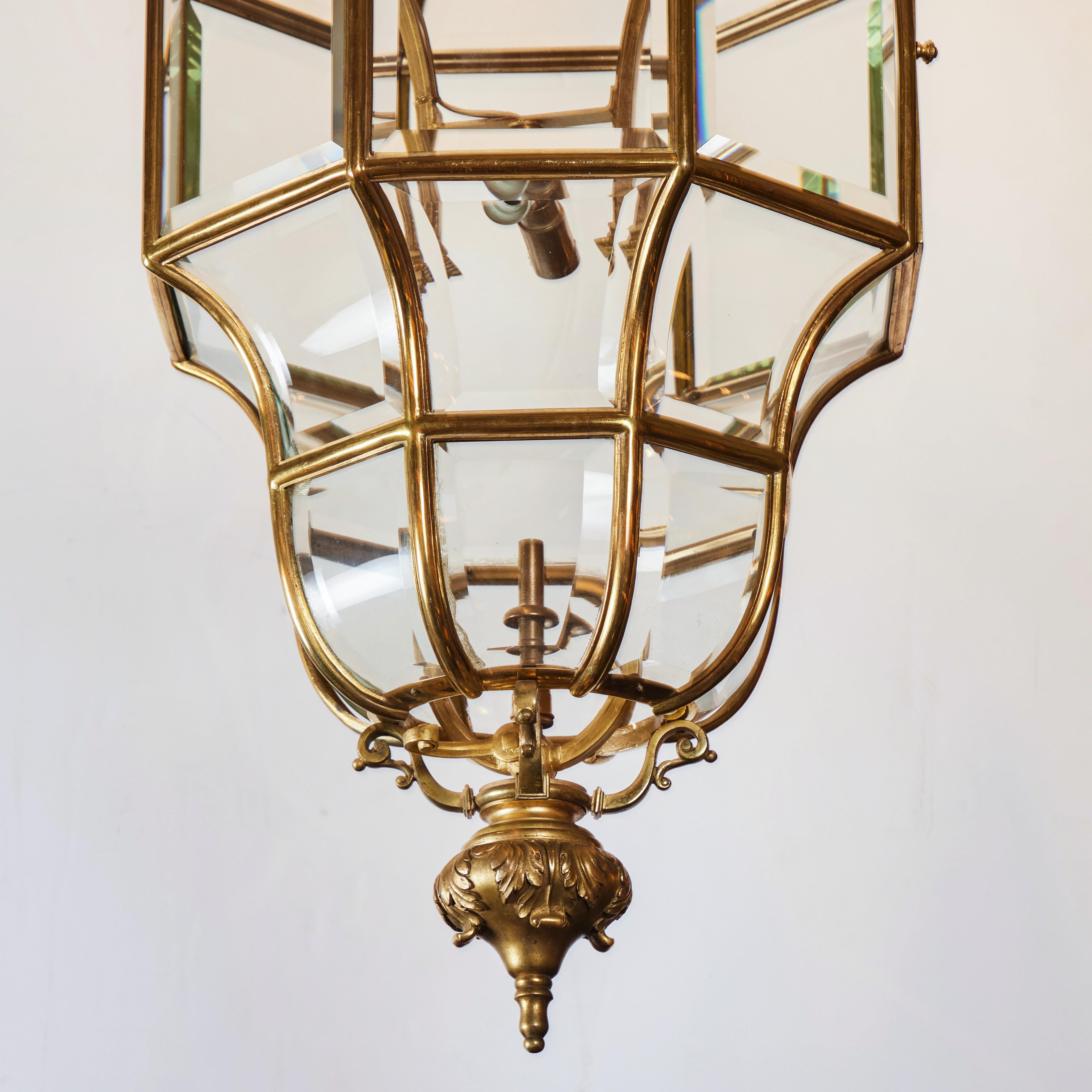 Elegant octagon shaped gold dore bronze gas lantern, later electrified with original beveled glass. Elaborate crown features fleur de lis and foliate designs. 2 lights, wired for USA.