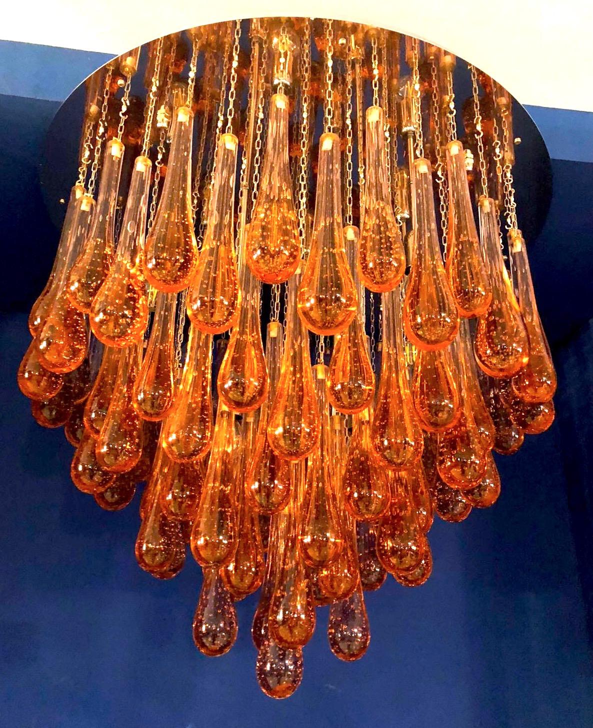 Gold drop modern Murano glass chandelier on brass frame.
Four E 14 light bulbs wired for US standards.
Variations available, size finishes, glass color.