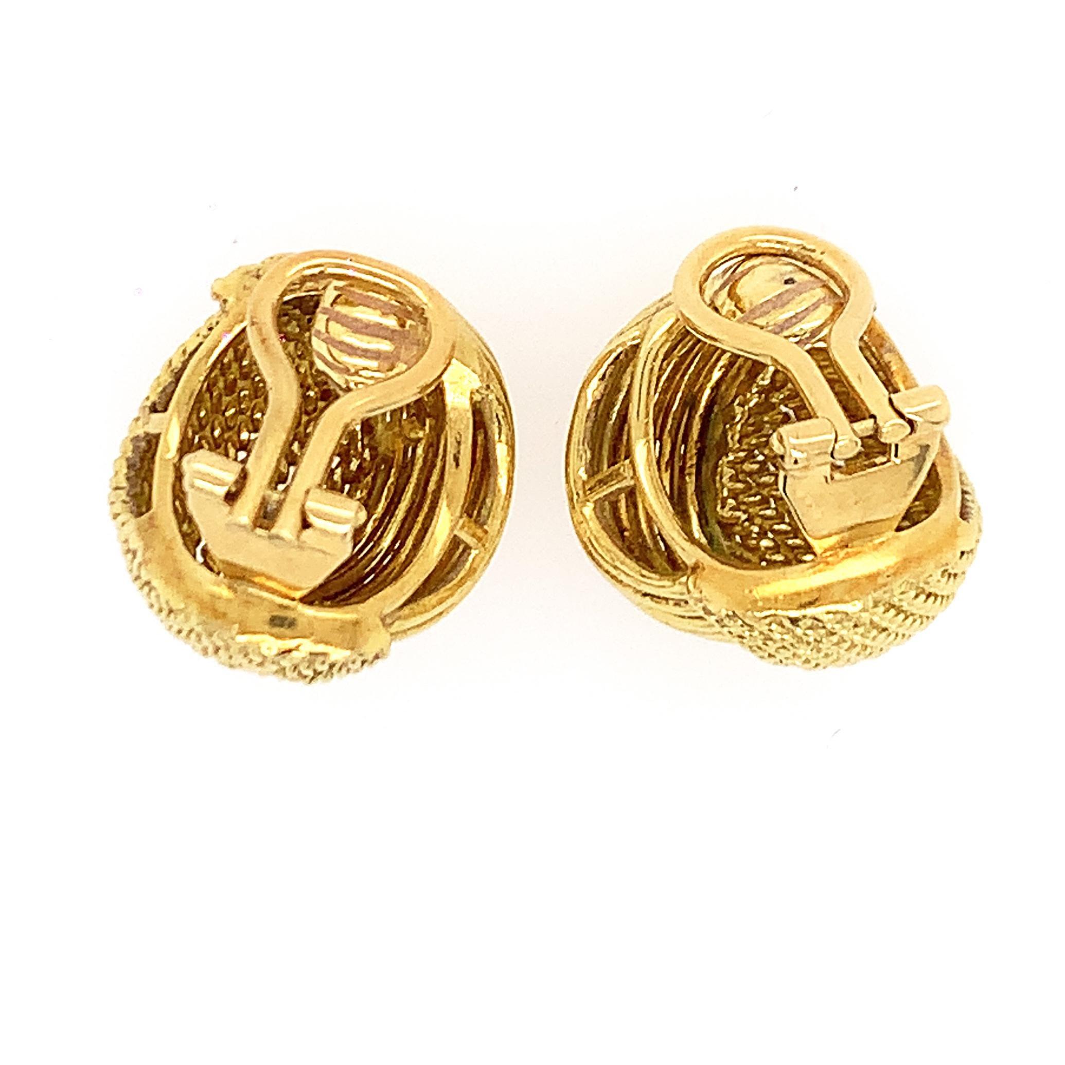 18K Y/gold earclips, stamps 18 KT Made in Italy, measures 7/8 inch in diameter, weight 12 dwt.