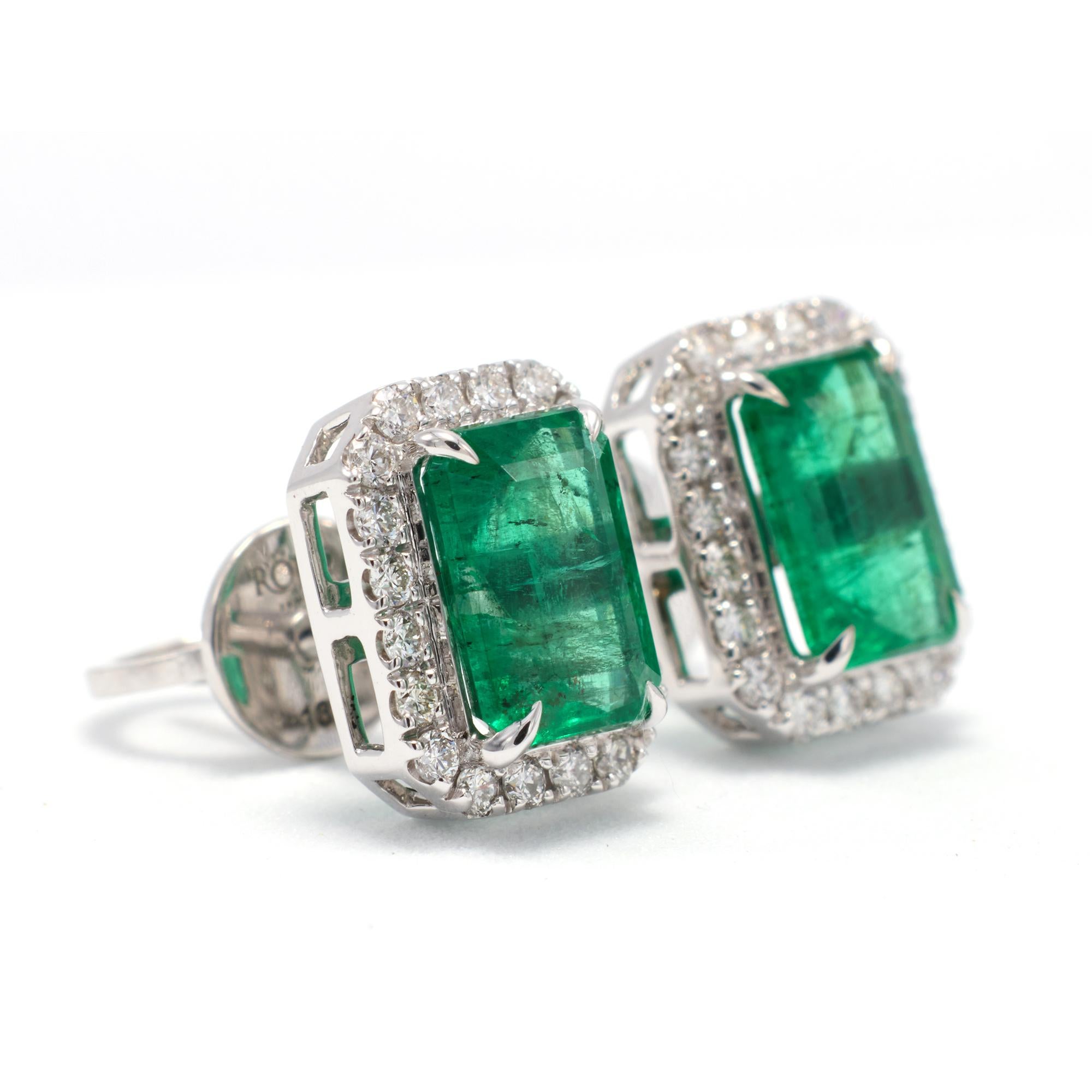 Emerald Octagons surrounded by dazzling VS diamonds set in 18k white gold

Attention all jewelry lovers! Introducing a stunning pair of stud earrings that will take your breath away. These 18k white gold studs feature vibrant emerald octagons,