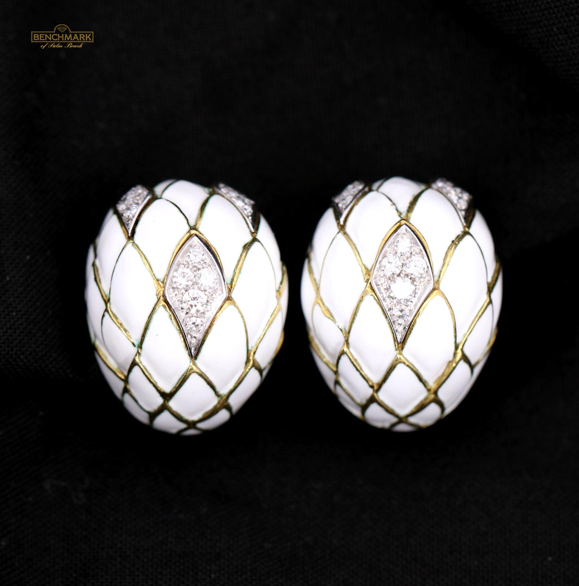 A pair of 18 karat yellow gold earrings with an artistic scale pattern measuring 5/8 of an inch wide, and 1 inch long. Each Earrings features 3 white gold plates set with assorted round brilliant and single cut diamonds. This wonderful pair of