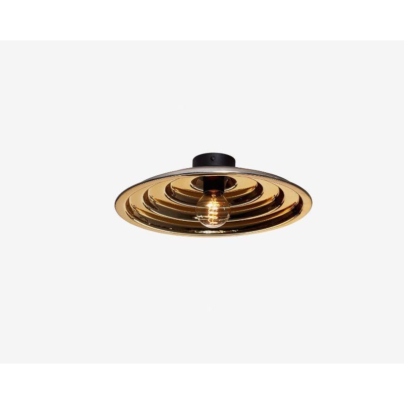 Gold echo ceiling light, small by Radar.
Design: Bastien Taillard.
Materials: Thermoformed gold glass, metal.
Dimensions: H 20 x D 40 cm.

Also available: In silver, and size Large (Diameter: 70), Wall base available in black metal or solid