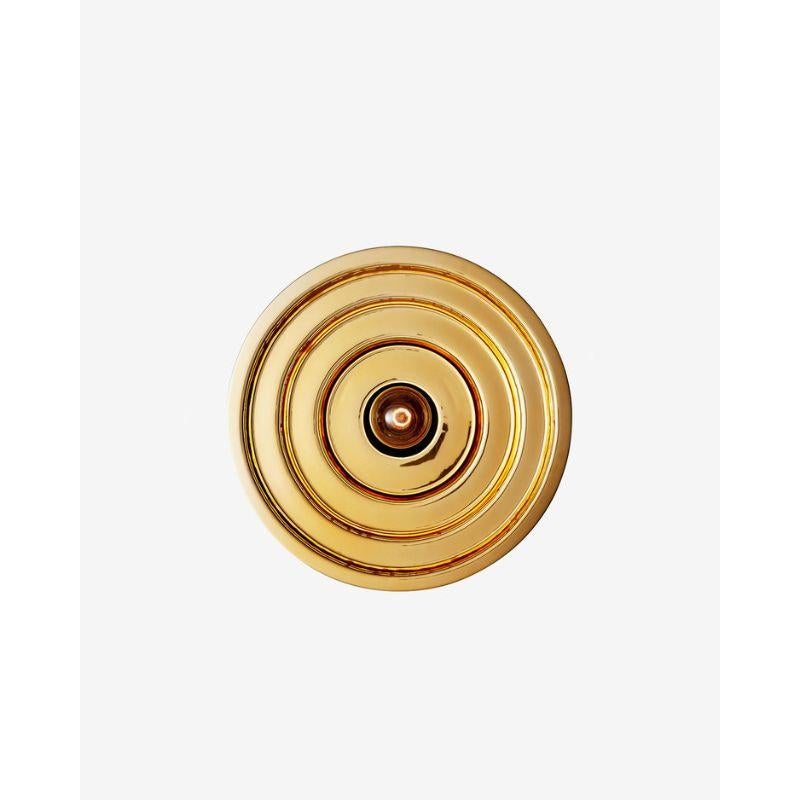 Gold Echo wall light, small by RADAR
Design: Bastien Taillard
Materials: Thermoformed gold glass, metal.
Dimensions: Depth 20 x Diameter 40 cm

Also available: In silver, and size Large (Diameter: 70), Wall base available in black metal or