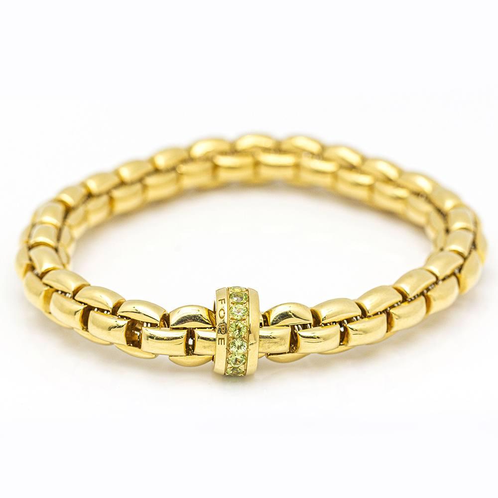 Women's Gold Elastic Bracelet with Peridot. For Sale