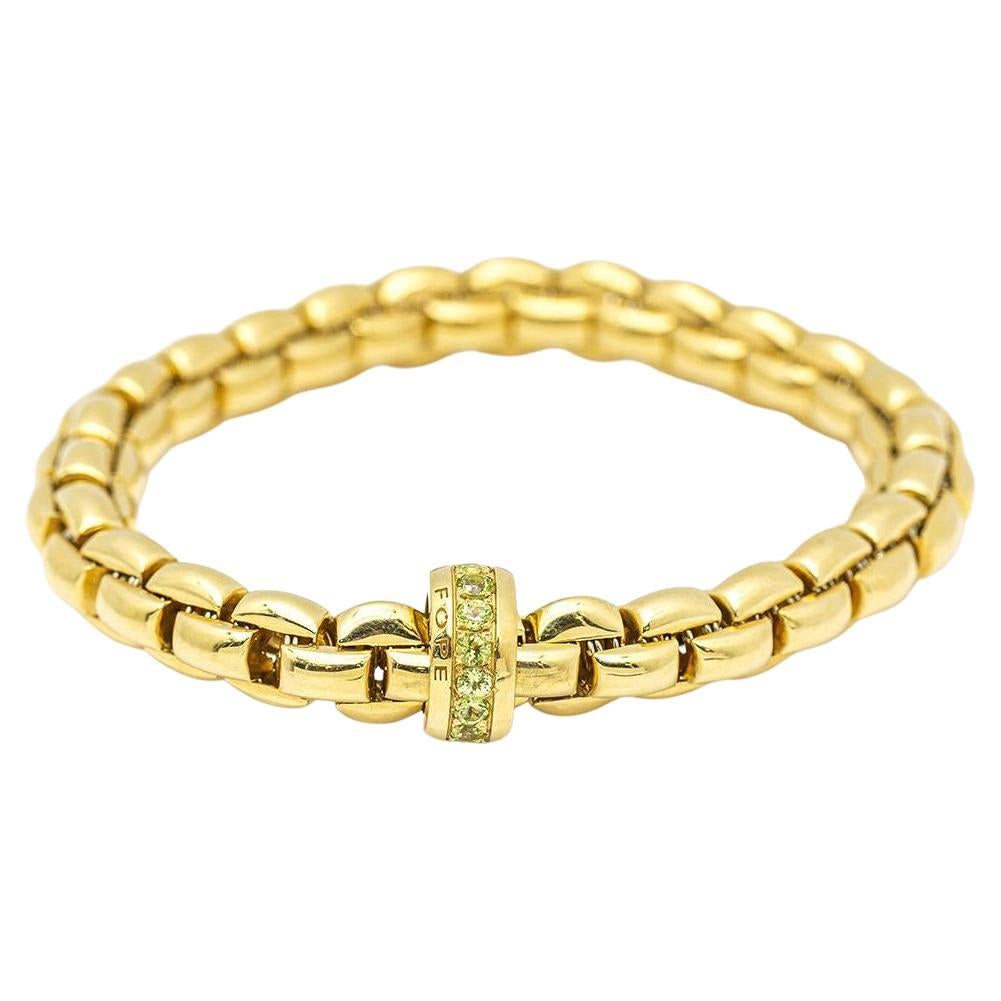 Bracelet élastique en or avec péridot. en vente