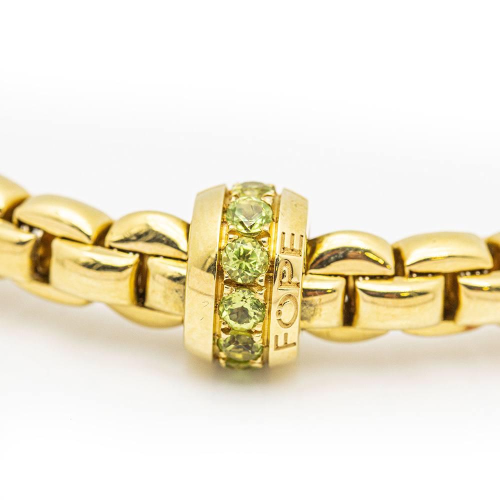 Italian Design FOPE Semi-Fastened Bracelet in Yellow Gold for women  11x Peridot with total weight 0,44ct  18kt Yellow Gold  This bracelet is made with elastic gold mesh, it expands and contracts so no clasp is needed.  25,20 grams  Diameter 20cm 
