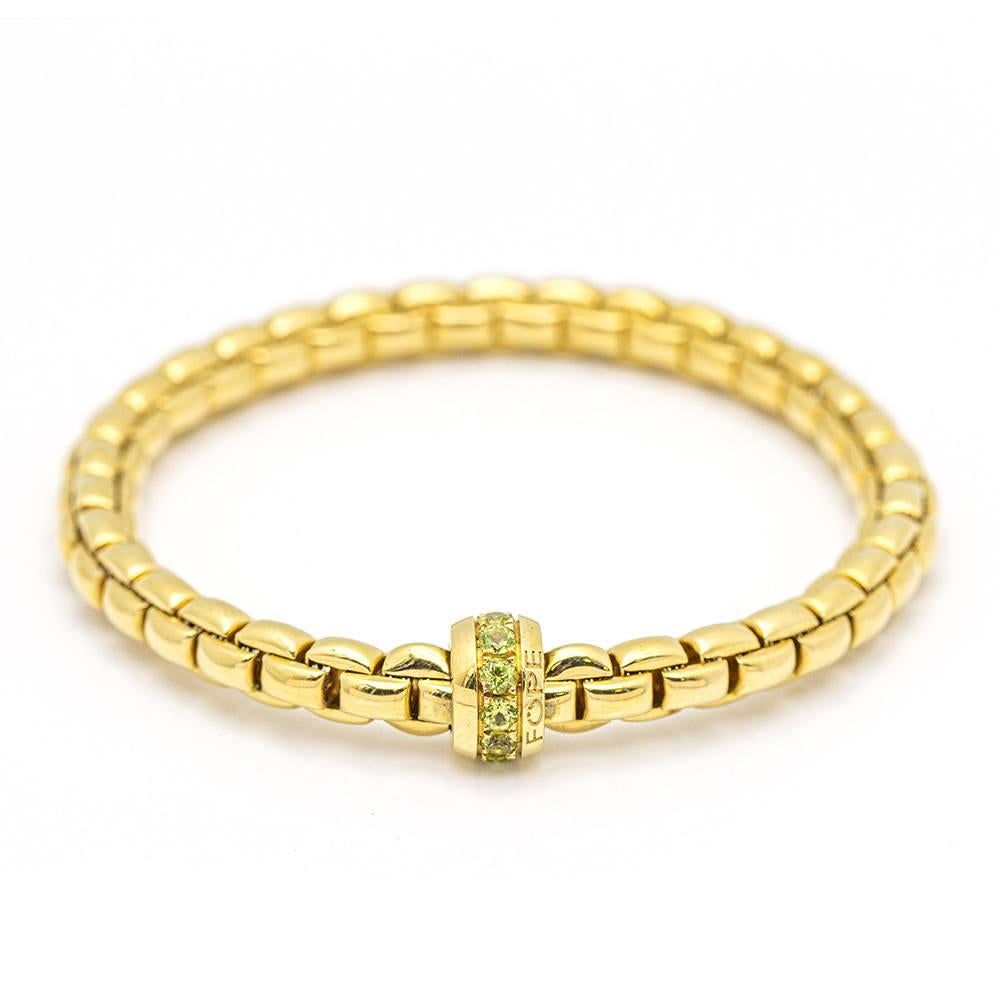 Gold Elastic Bracelet with Peridots For Sale