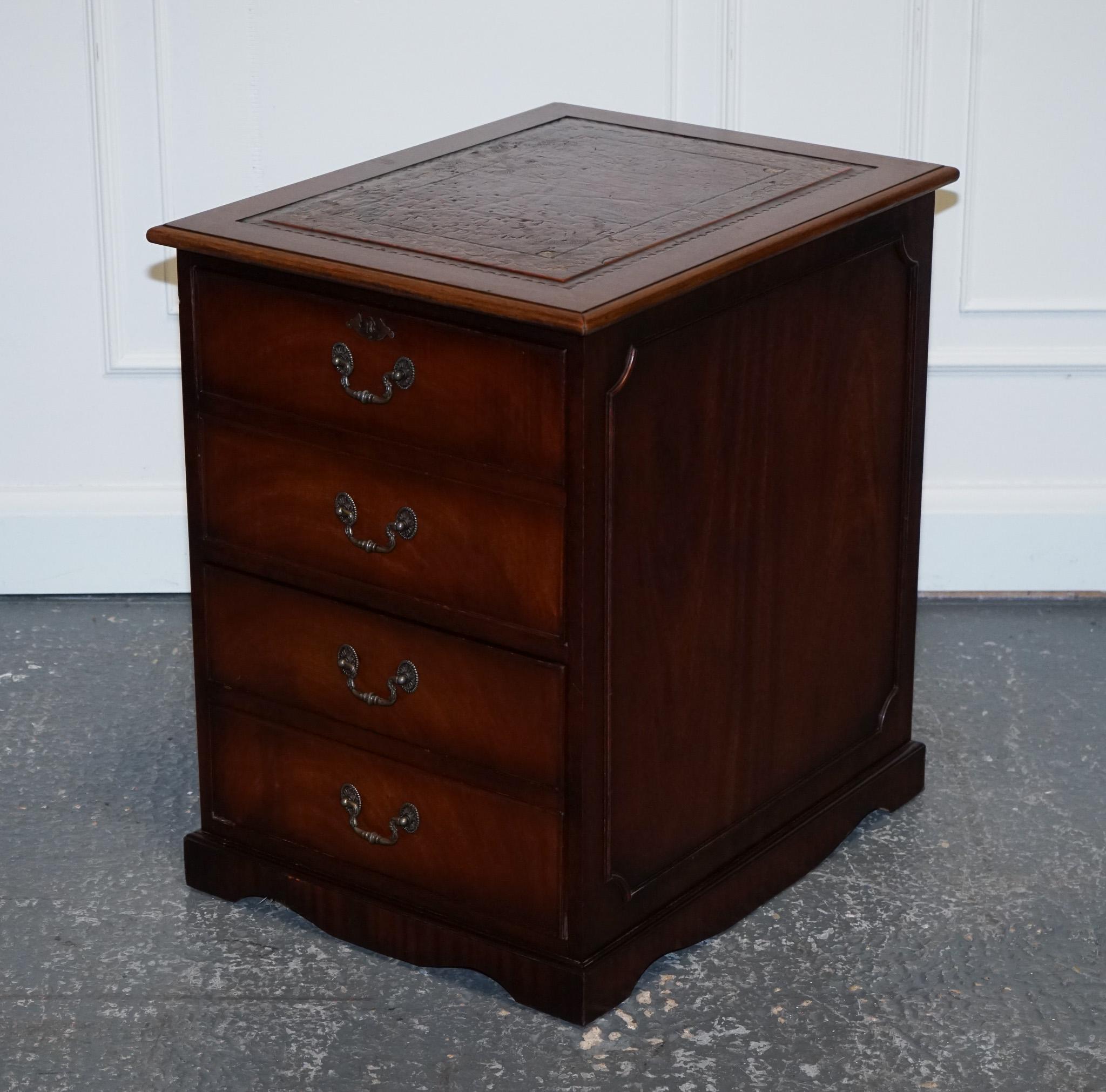 
We are delighted to offer for sale this Lovely Mahogany Brown Leather Filing Cabinet.
 
This stunning vintage filing cabinet is a true statement piece, featuring a beautiful combination of gold and brown. The cabinet boasts two spacious drawers,