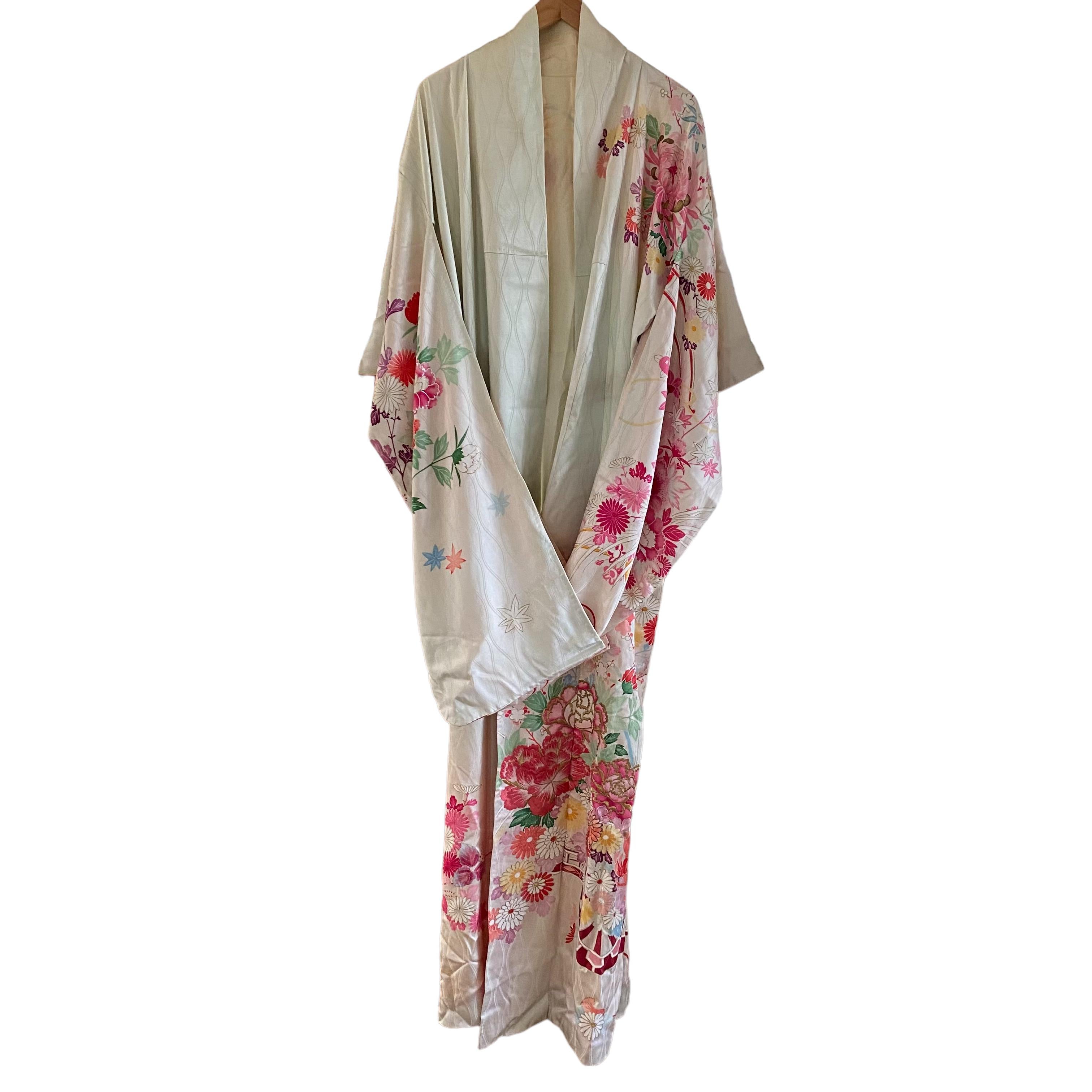 Circa: 1920-1930
Place of Origin: Japan
Material: Silk
Condition: Excellent. Only a few faint spots.
Faint aqua color silk background with gorgeous shades of pink-red and multicolor bouquets and gold embroidery.  Further embellished with gold and