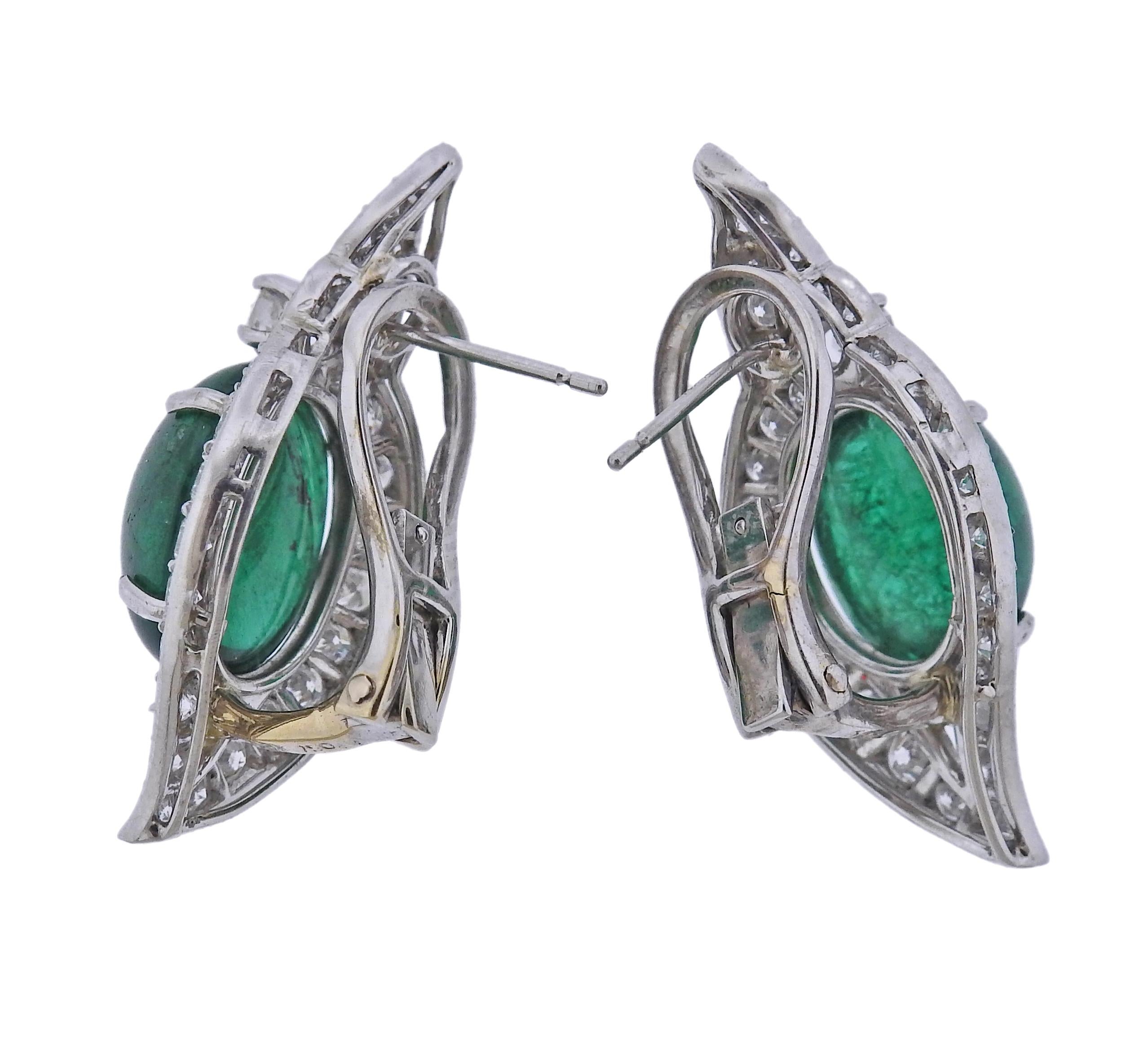 Pair of 18k gold earrings, with two oval emerald cabochons (stones have minor nicks and chips) - each approx. 6.80ct. Surrounded with approx.2.20ctw in diamonds. Earrings measure 32mm x 15mm. Marked 750 18k. Weight - 13.9 grams.