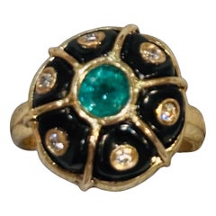 Anello in oro, smeraldo, diamanti e onice nera