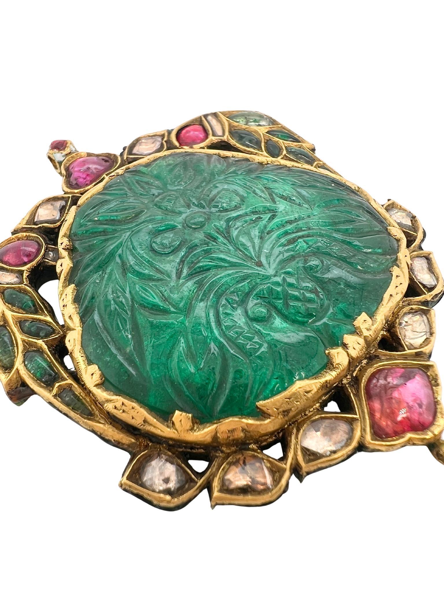 Gold Emerald Ruby and Diamond Pendant 

Details:
On the back of the pendant featuring enamel birds and flowers 
Length 3