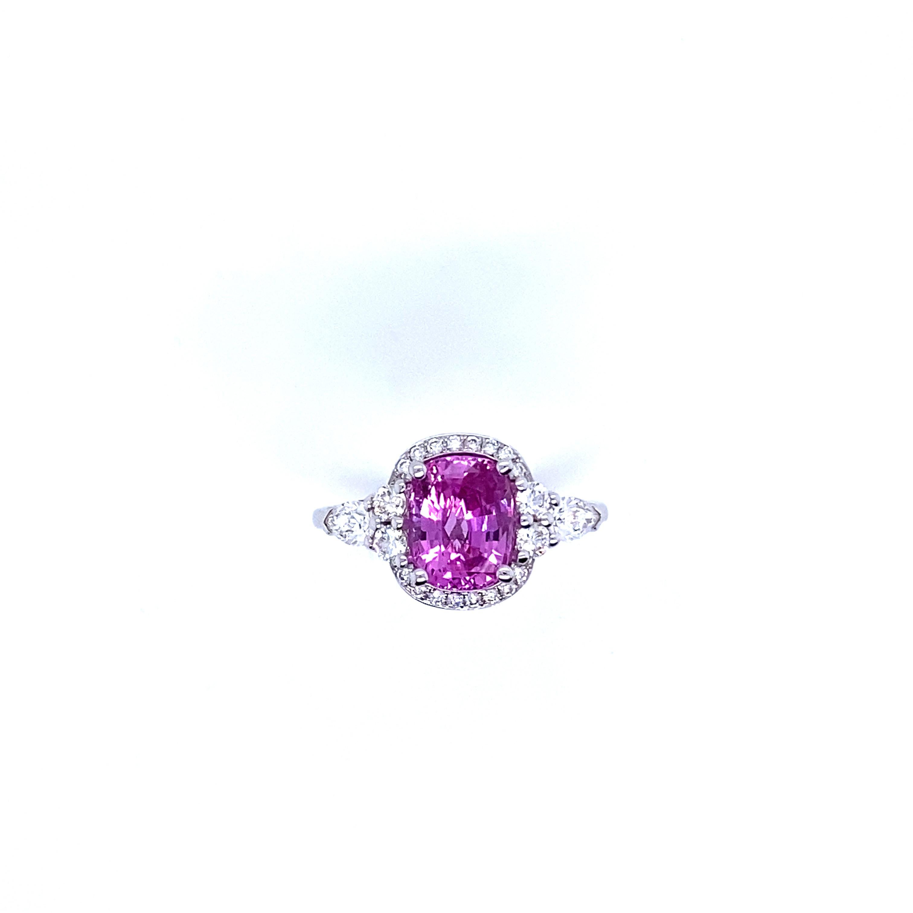 Women's Gold Engagement Ring Surmounted by a Pink Sapphire Surrounded by Diamonds