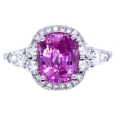 Gold Engagement Ring Surmounted by a Pink Sapphire Surrounded by Diamonds