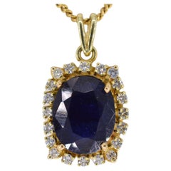 Gold Entourage Pendant with Sapphire and Diamonds