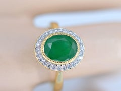 Gold Entourage Ring with Diamonds and Emerald