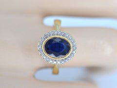Gold Entourage Ring with Diamonds and Sapphire