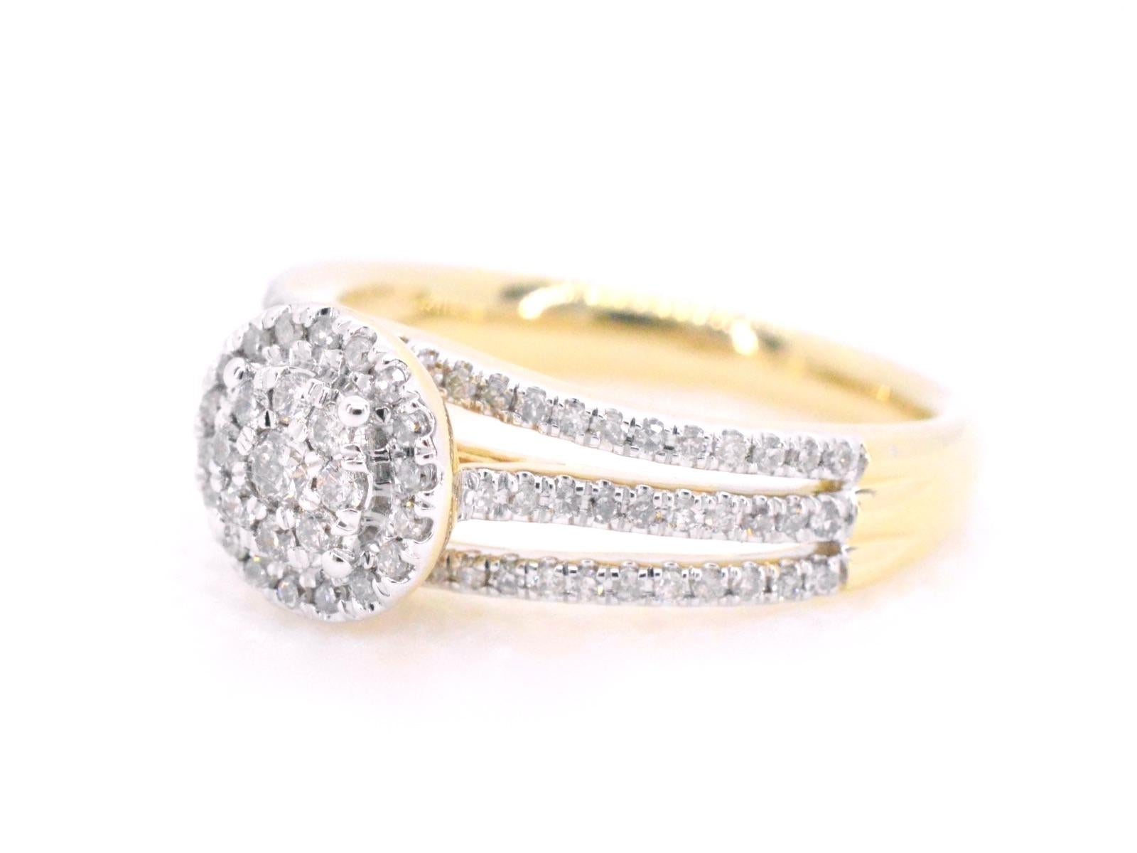 This exquisite gold entourage ring features a stunning combination of brilliant and round cut diamonds. The diamonds are arranged in a beautiful entourage setting, creating a breathtaking display of sparkle and fire. The high-quality gold band adds