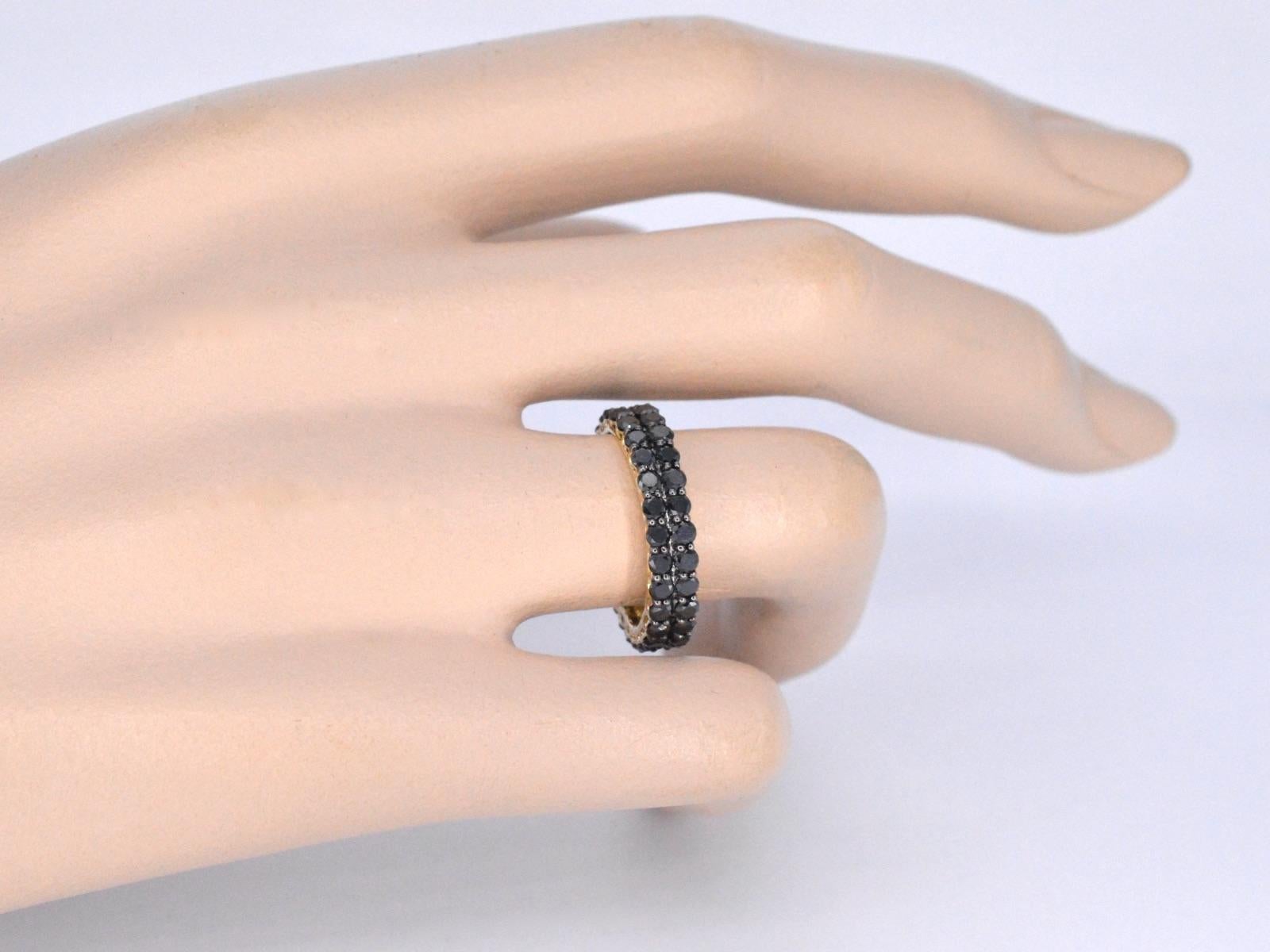 Contemporary Gold Eternity Ring with Black Diamonds For Sale