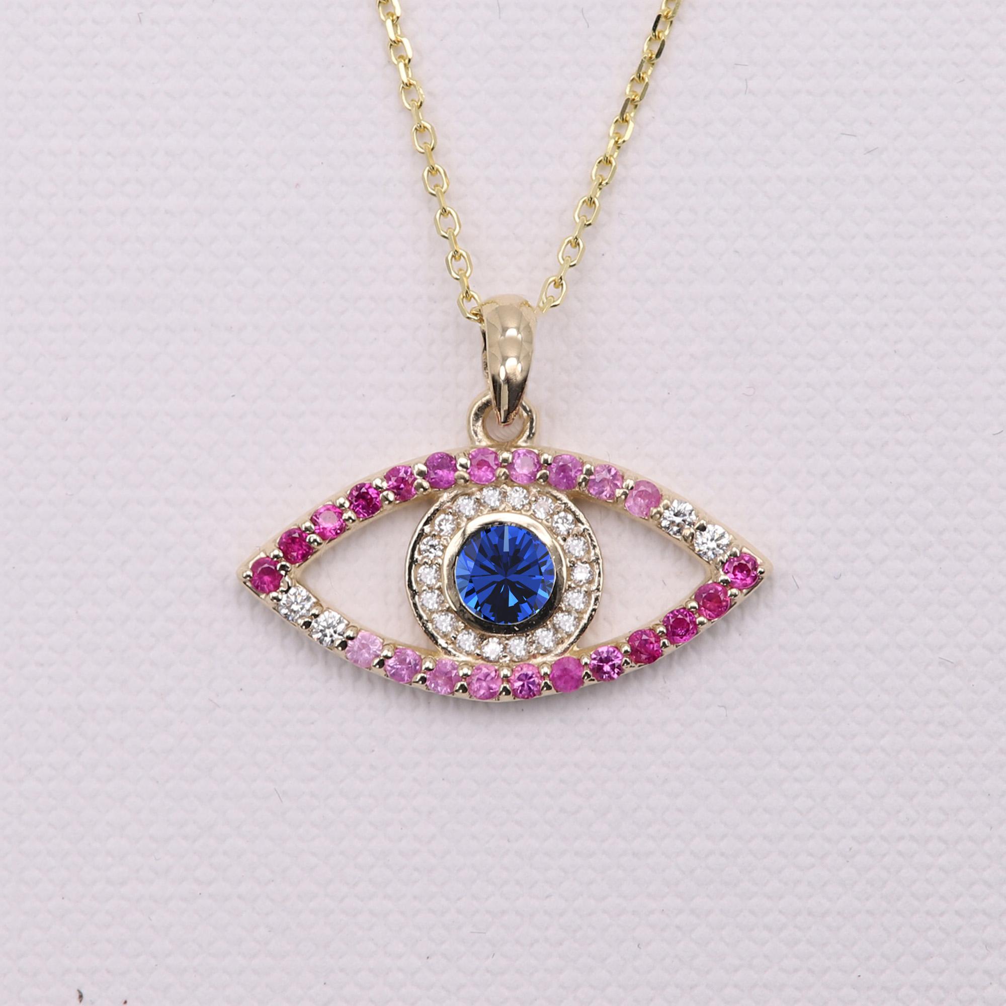 Brilliant Colors of mixed natural Gemstones
made in USA Evil Eye pendant 
14k Yellow Gold 2.0 grams (weight without the chain)
Center approx. 0.40 carat Blue Sapphire [Ceylon]
Small natural Diamonds approx.0.10 carat G-VS
Red and Pink natural