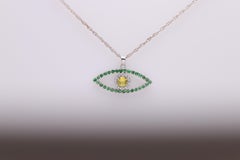 Gold Evil Eye 14 Karat White Gold Green Tsavorite and Yellow Sapphire