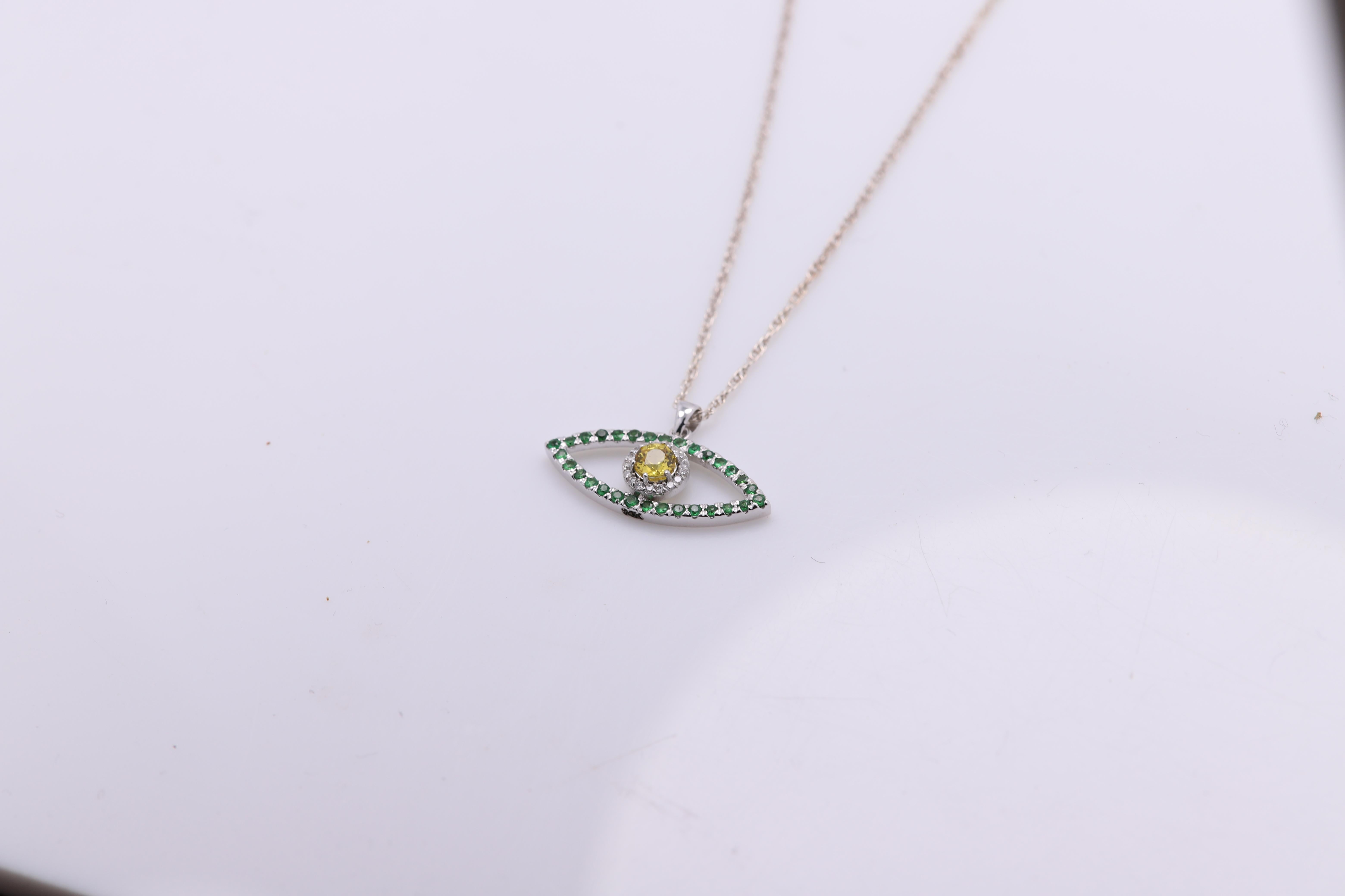 Taglio rotondo Malocchio d'oro 14 carati in oro bianco con zaffiro giallo e tsavorite verde in vendita